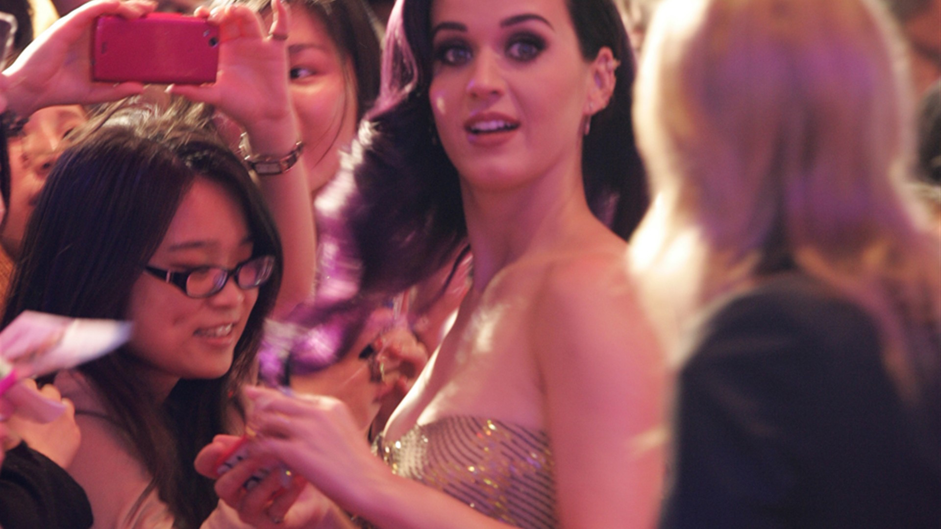 Katy Perry at red carpet premiere smiling in vibrant style