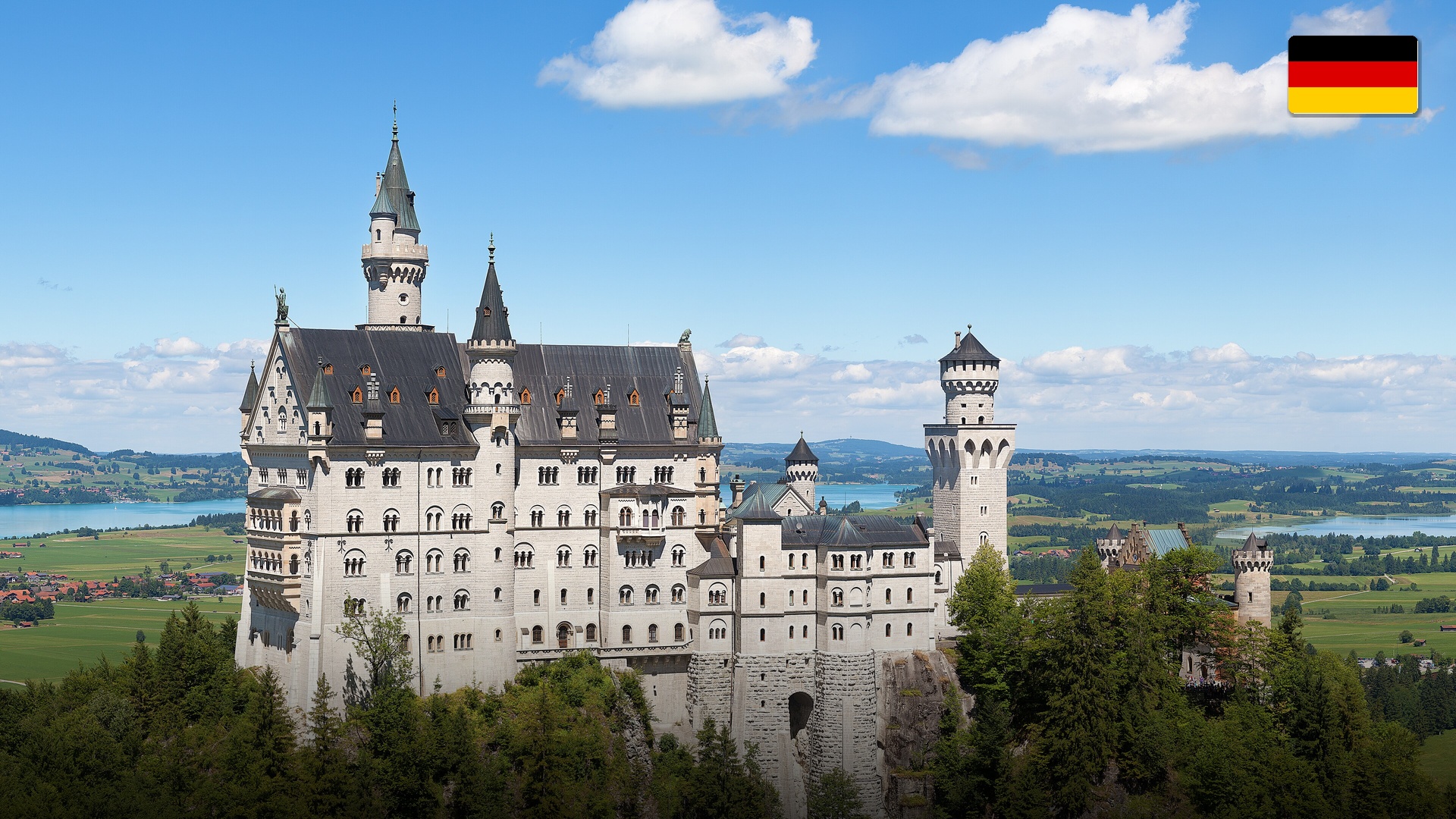 Fairytale Neuschwanstein Castle perched on a rugged alpine hill in Bavaria, Germany.