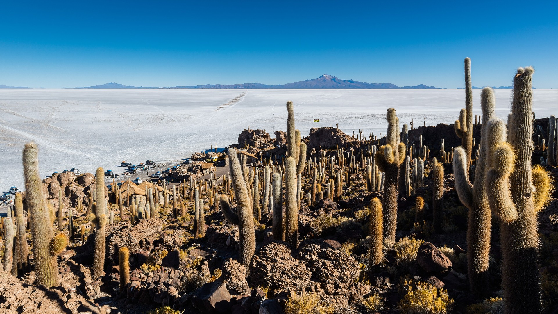 Flooded salt crust of Salar de Uyuni in Bolivia creating a mirror reflection of the sky and clouds.