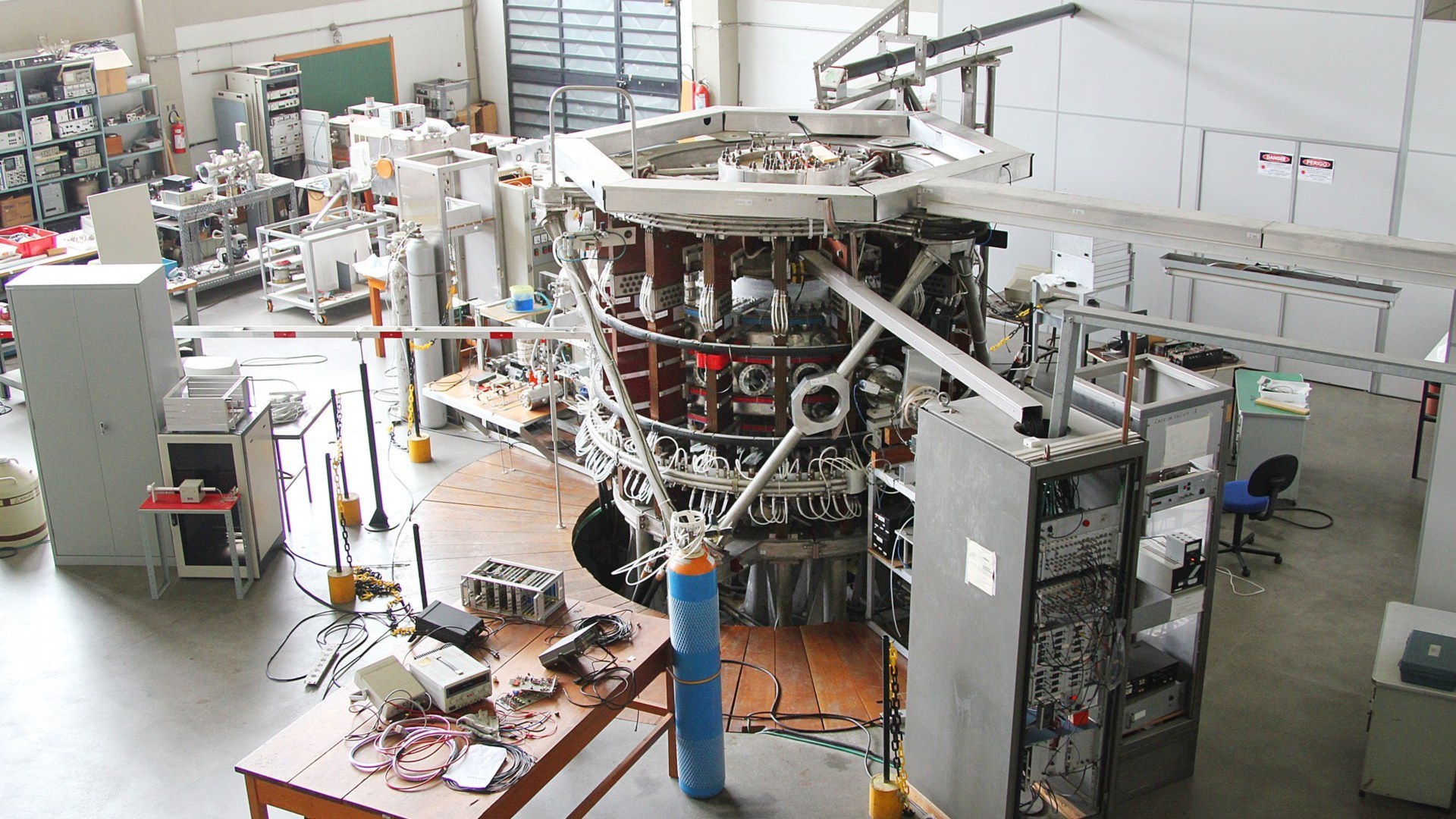 TCABR tokamak plasma fusion research reactor inside a physics laboratory.