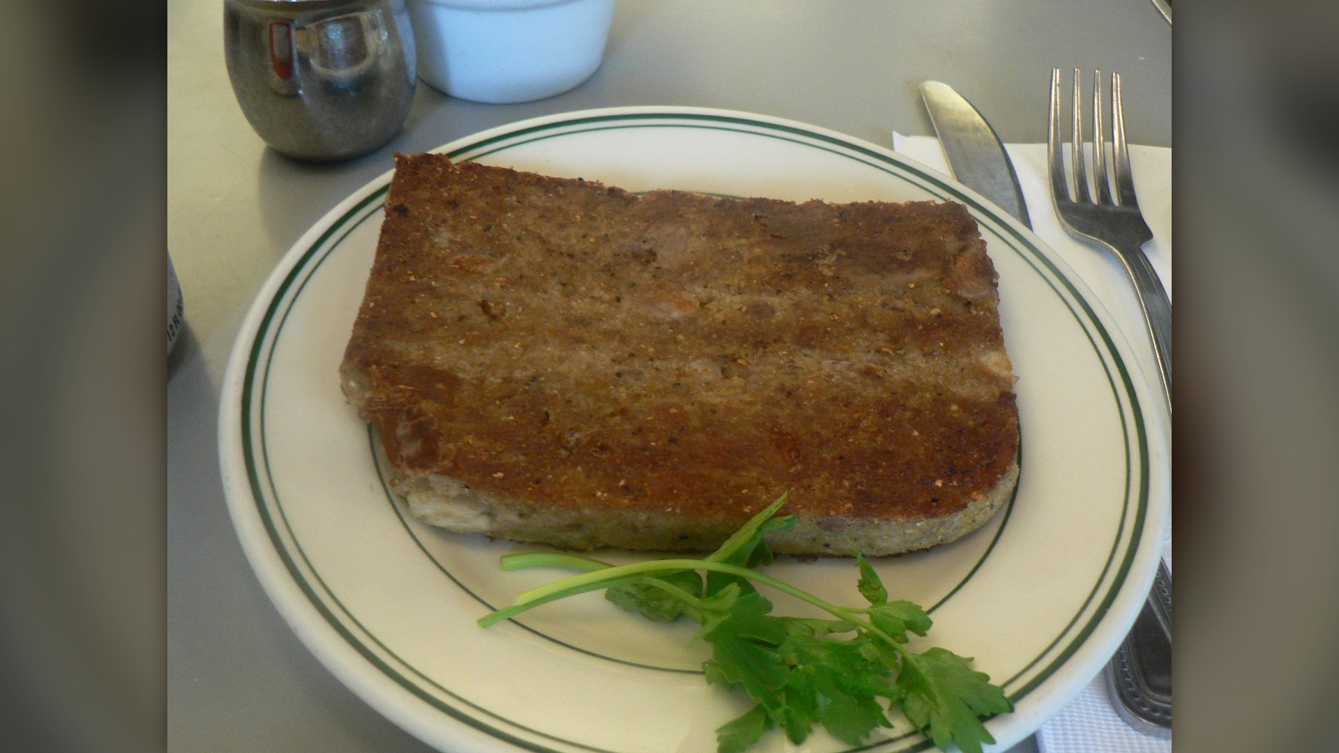 A plate of pan-fried Mid-Atlantic scrapple slices.