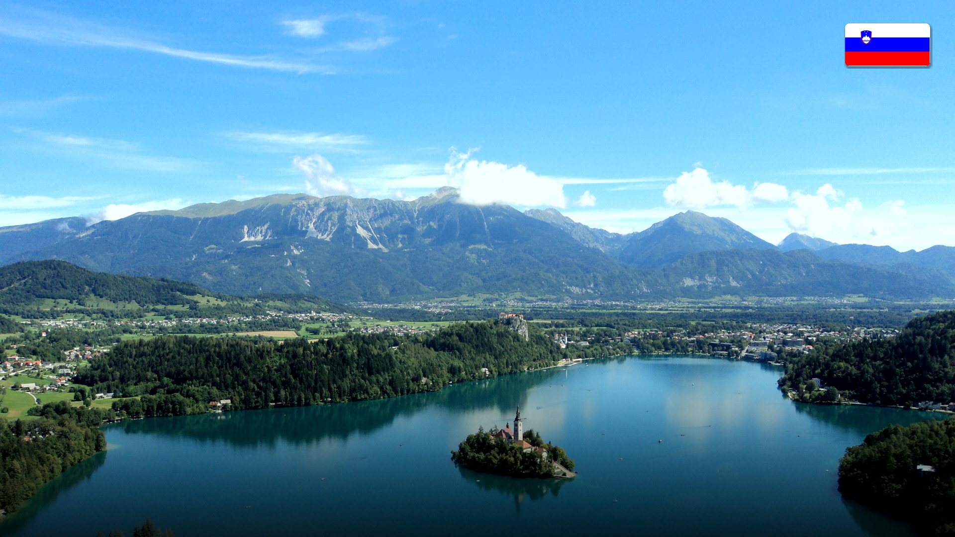 Lake Bled with its iconic church island surrounded by green alpine mountains in Slovenia.