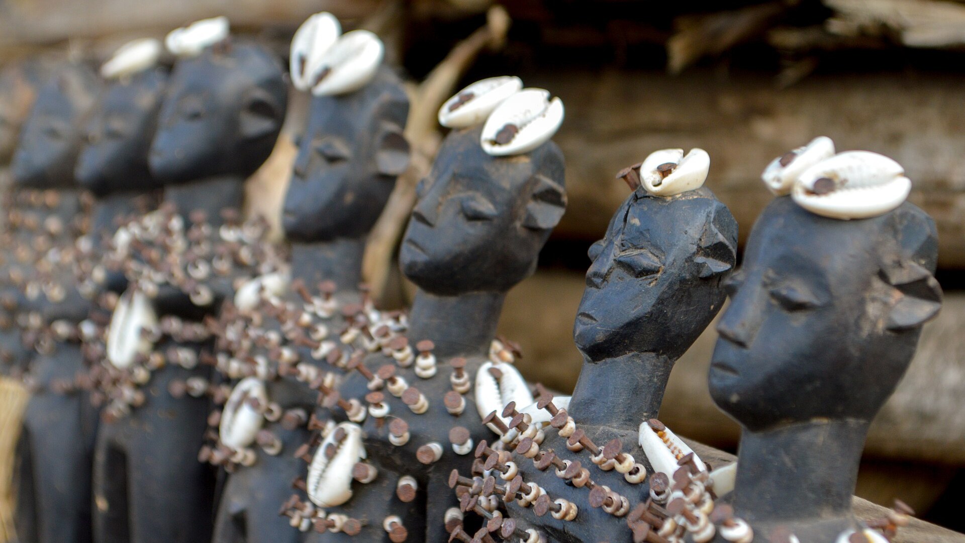 Traditional hand-carved wooden Vodun dolls and ritual fetishes from Togo