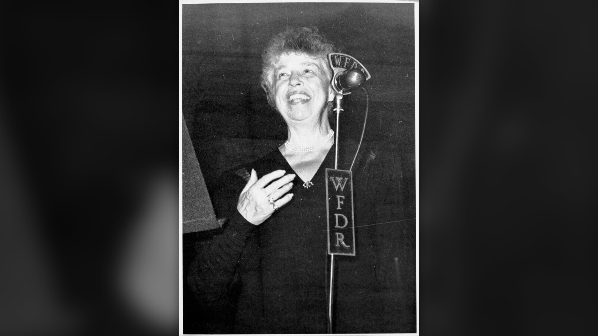 Eleanor Roosevelt speaking into a WFDR studio microphone.