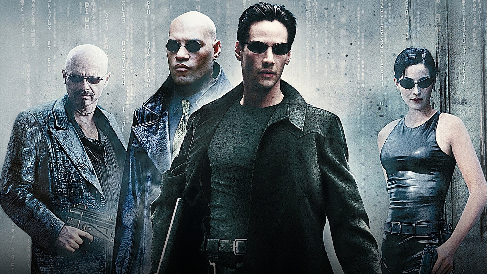 Keanu Reeves as Neo in sunglasses alongside Morpheus in The Matrix.