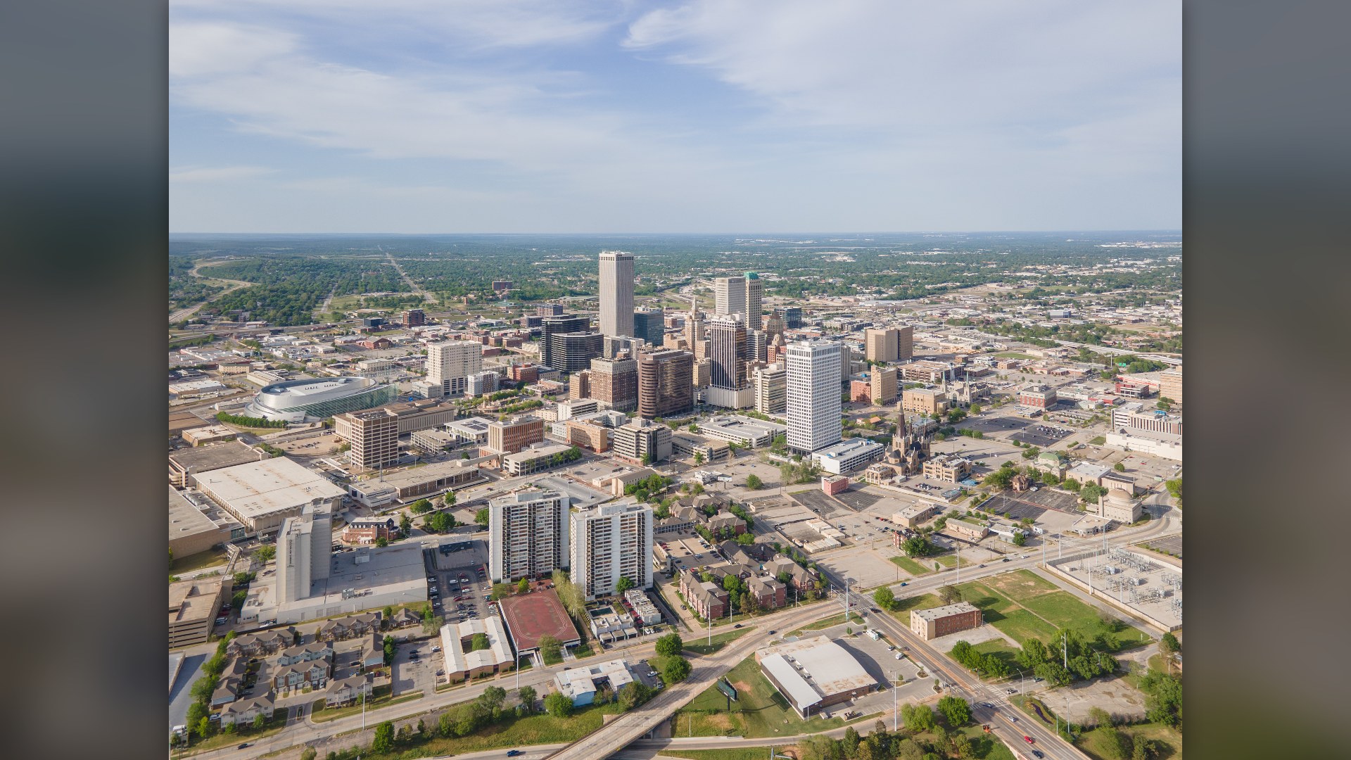 Aerial view of the Tulsa, Oklahoma skyline and green river valley.