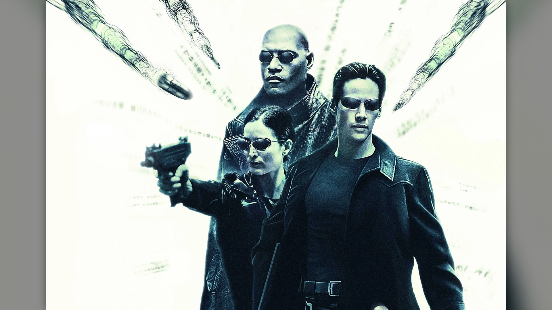 Neo leans backward in slow motion dodging a streak of bullets on a skyscraper rooftop in The Matrix.