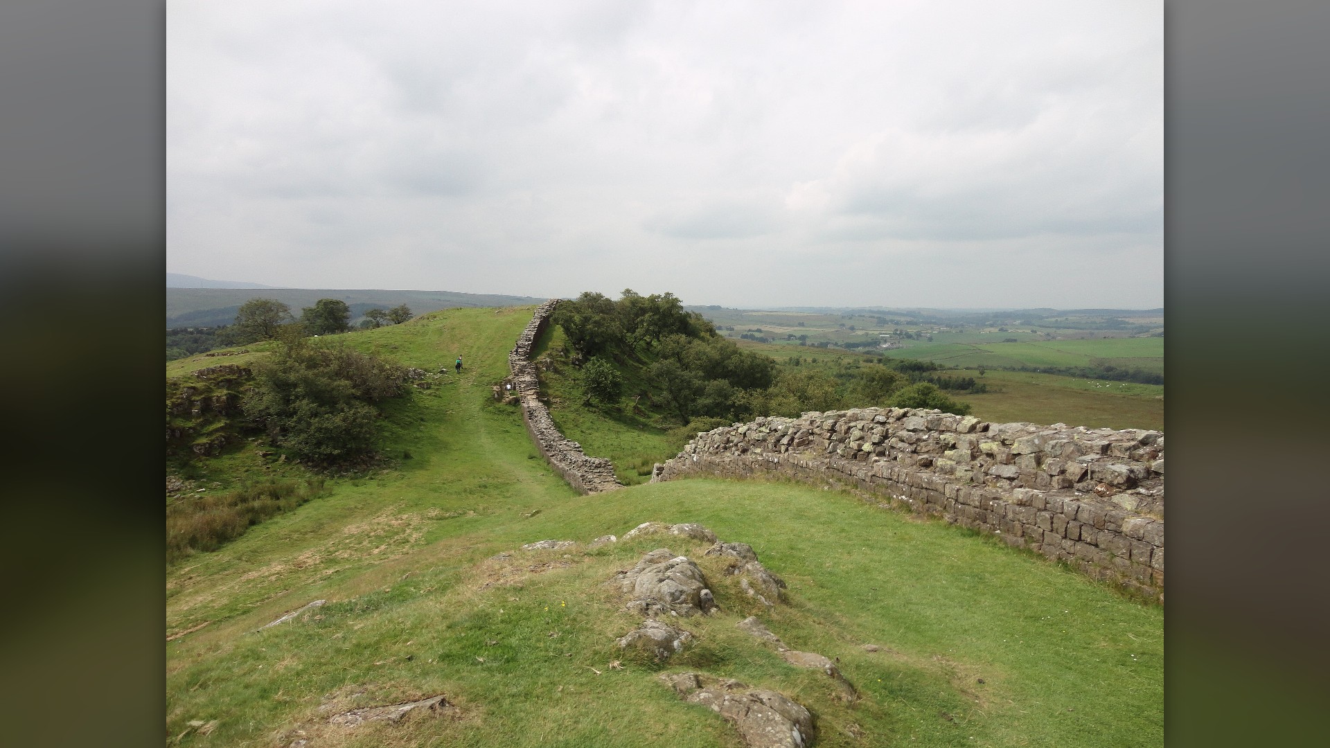 Aerial view of Hadrian's Wall and Milecastle 39 snaking across the hills of northern England.