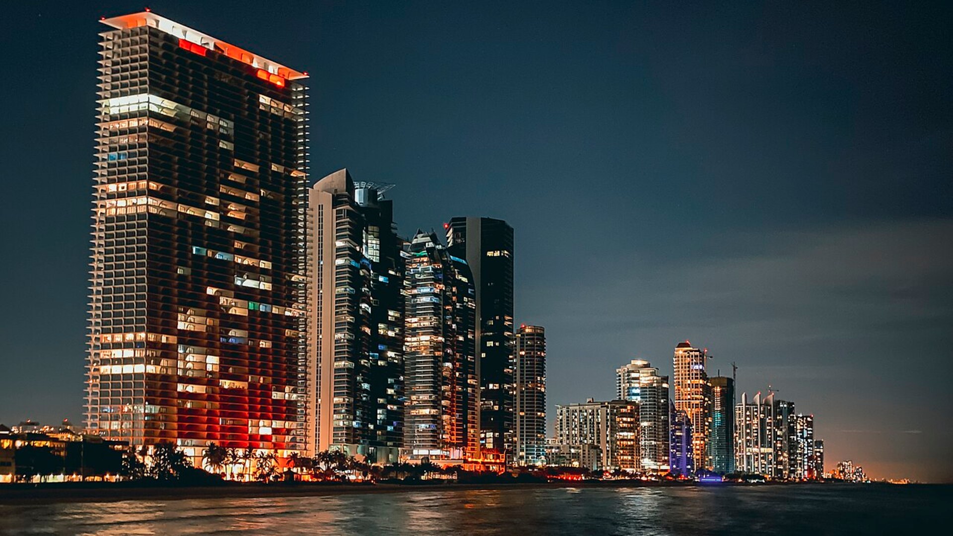 Downtown Miami skyline seen across the ocean water.