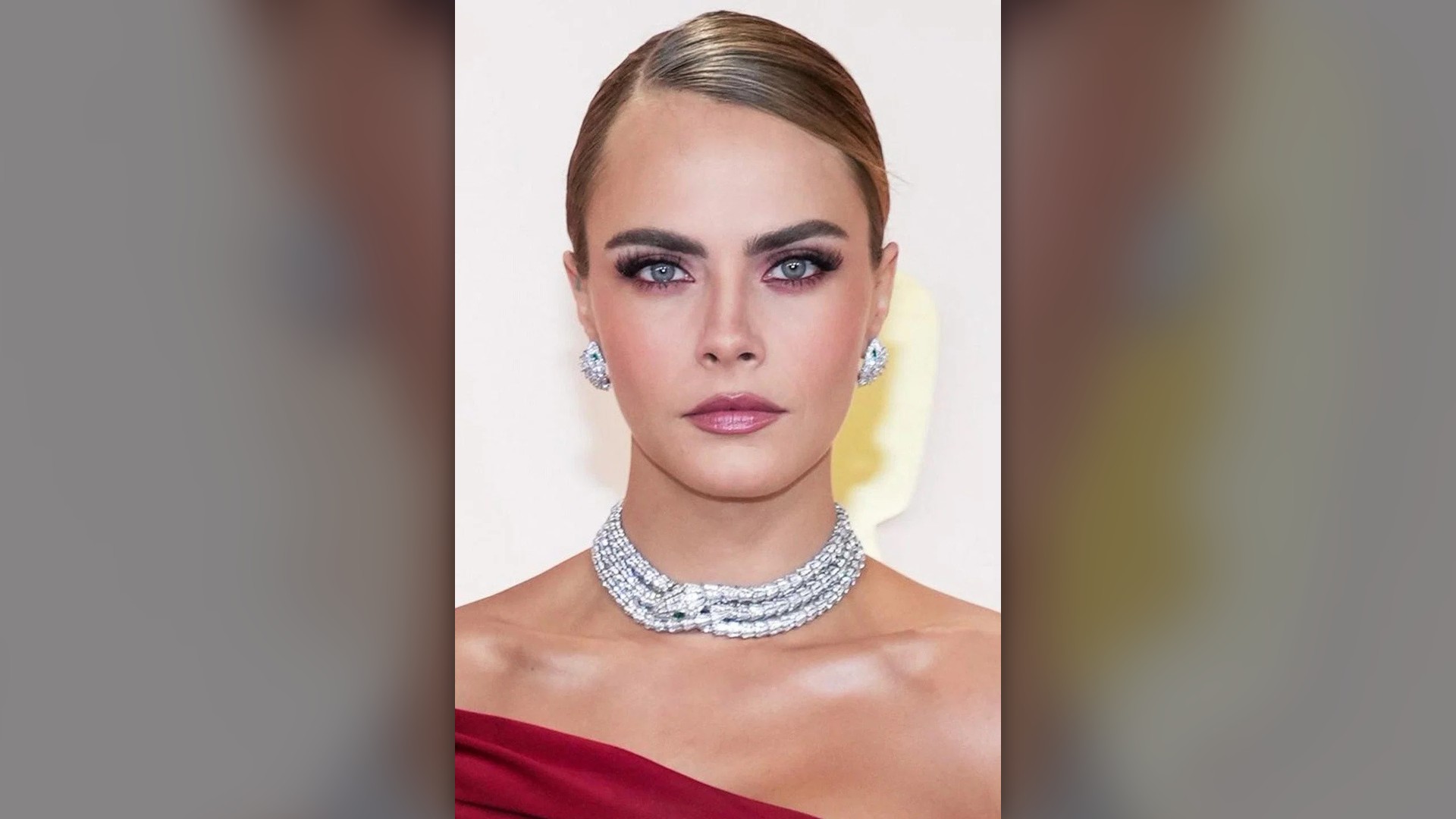 British supermodel Cara Delevingne posing at a film premiere.