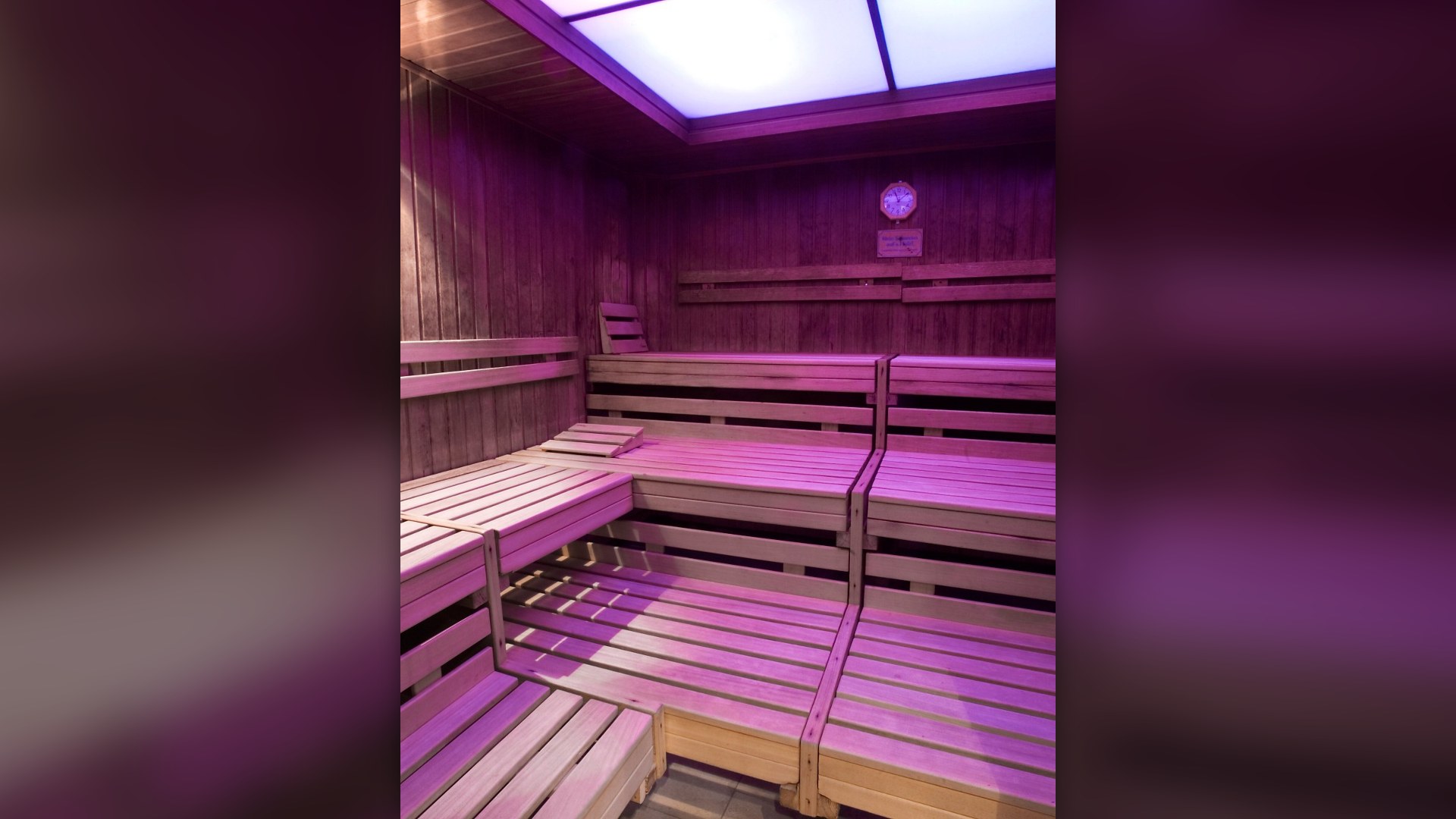 Authentic wooden sauna room inside a historic public bathhouse in Munich.