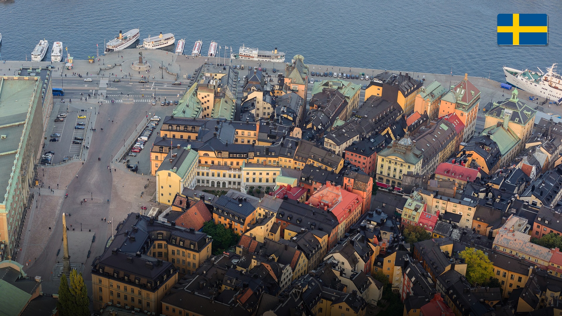 Warmly painted 17th-century townhouses along the historic waterfront in Gamla Stan, Stockholm.