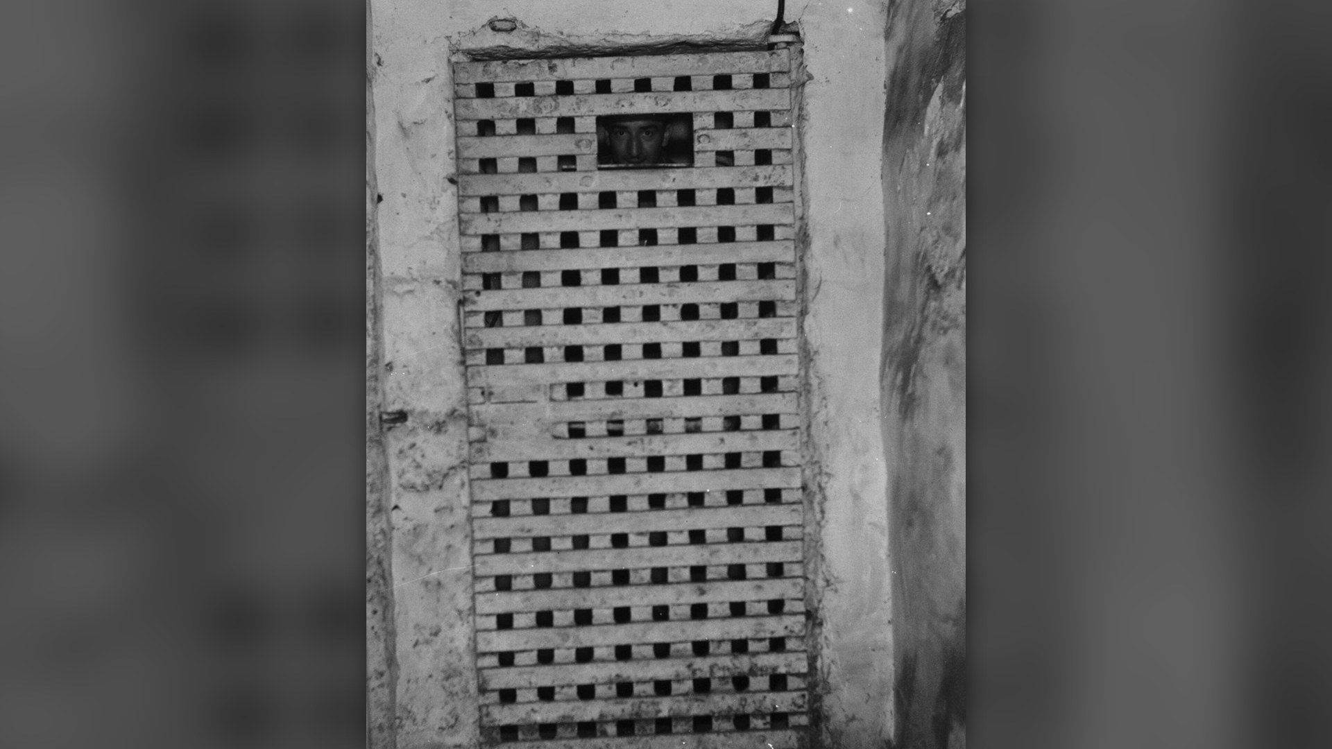 High-security heavy steel door to correctional cell corridor