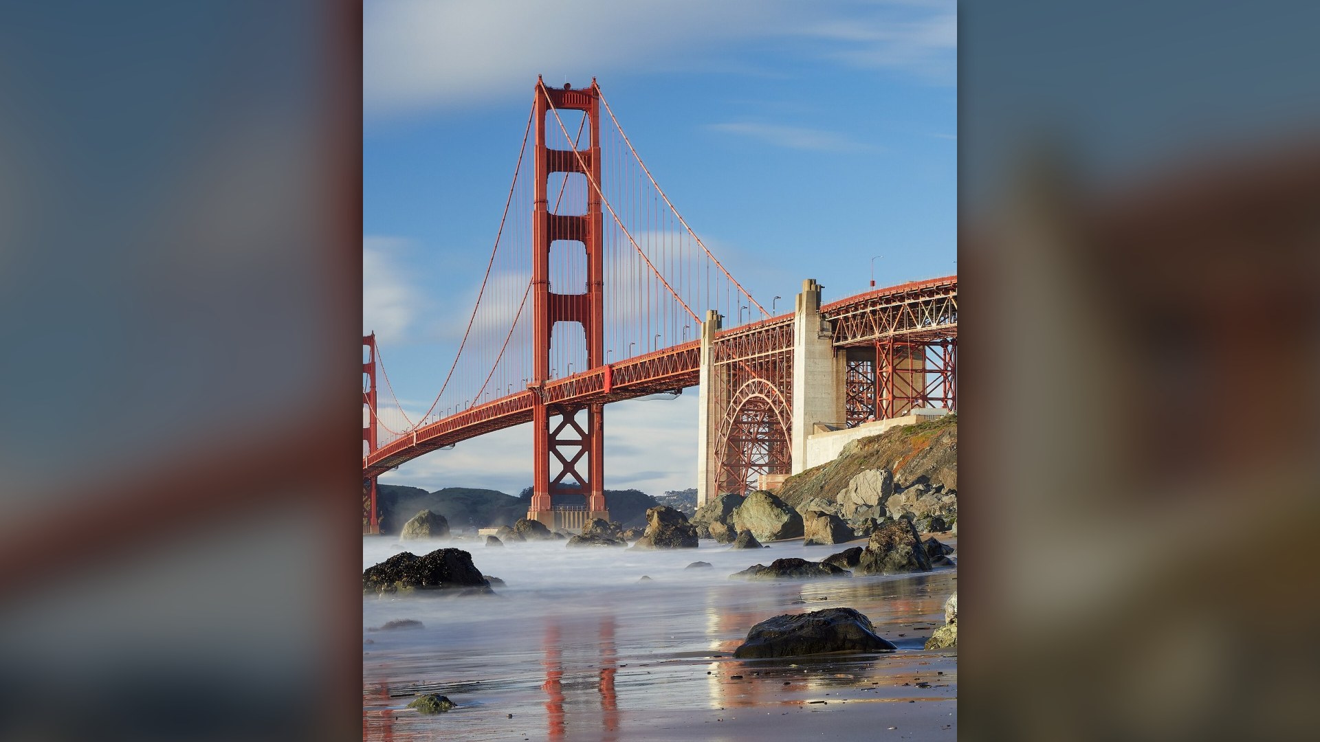 Golden Gate Bridge spanning the San Francisco Bay entrance at sunset in California.