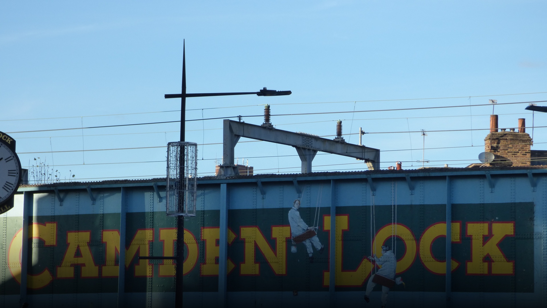 The iconic Camden Lock railway bridge crossing over Chalk Farm Road in Camden Town, London.