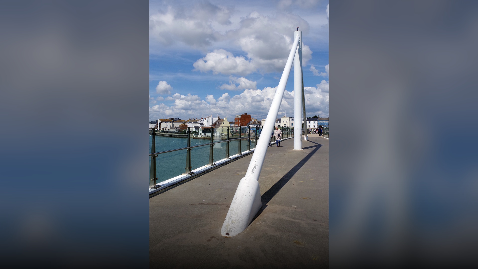 The modern sweeping Adur Ferry Bridge pedestrian span across the River Adur in Shoreham-by-Sea.