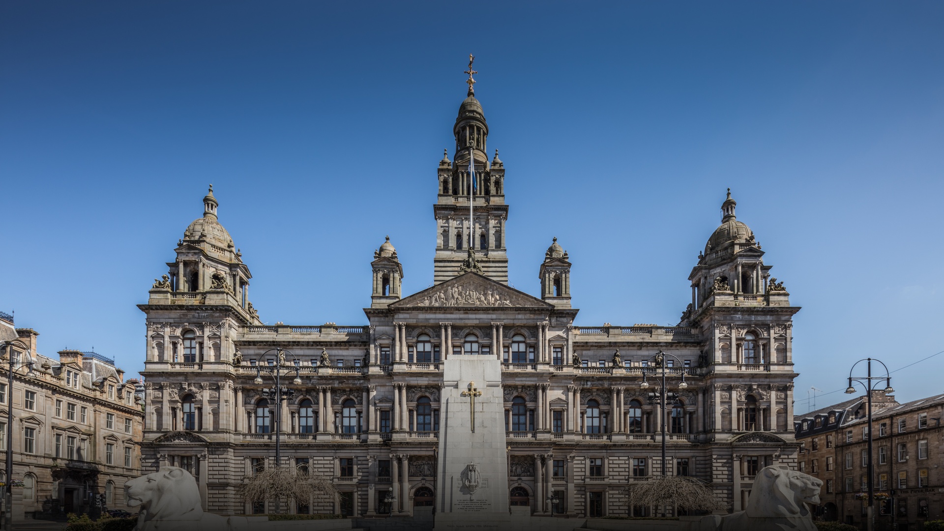 The imposing Victorian Italianate facade and pediment of Glasgow City Chambers on George Square in Glasgow.