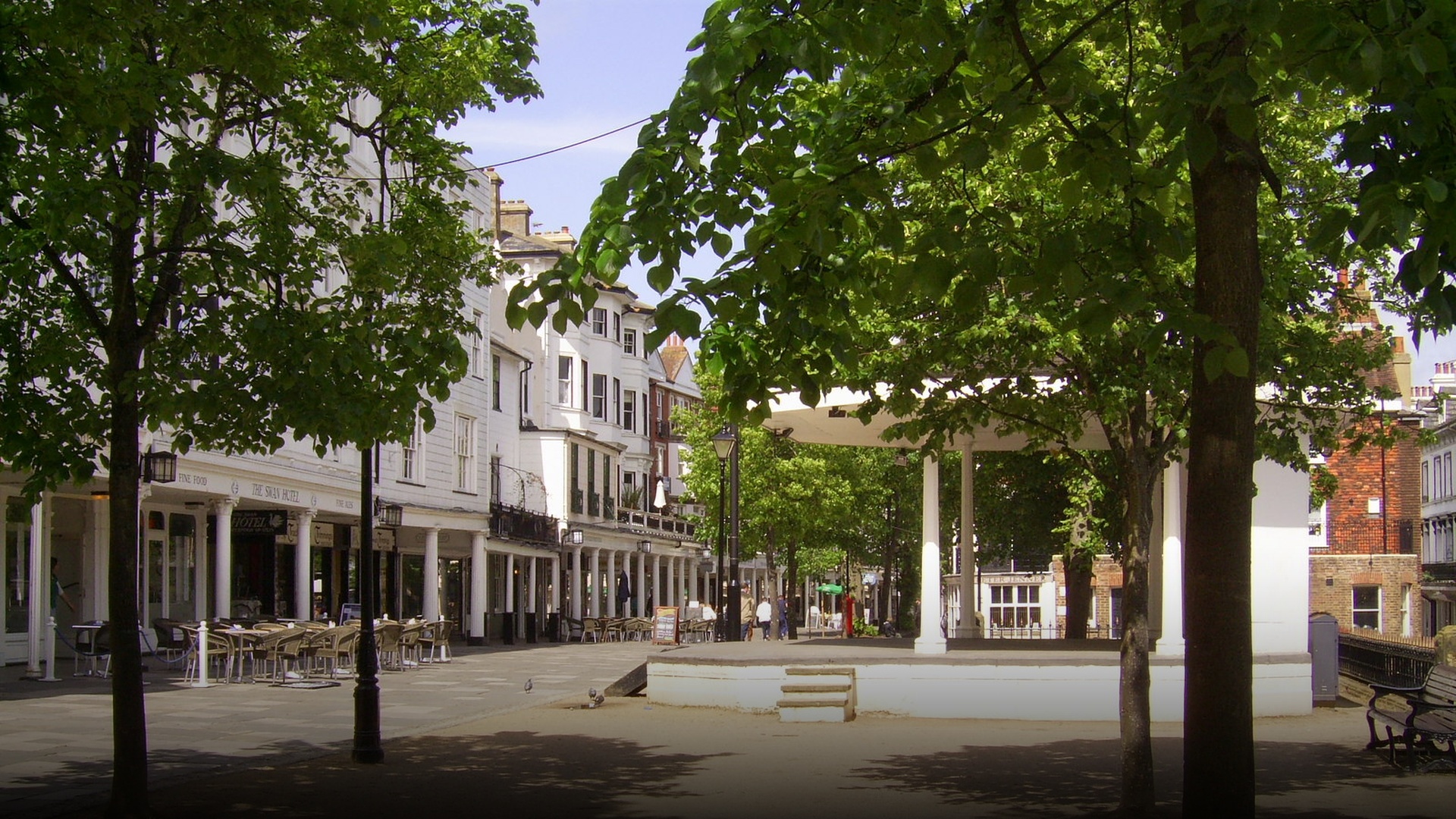 The charming Georgian colonnade and tree-lined promenade of The Pantiles in Royal Tunbridge Wells.