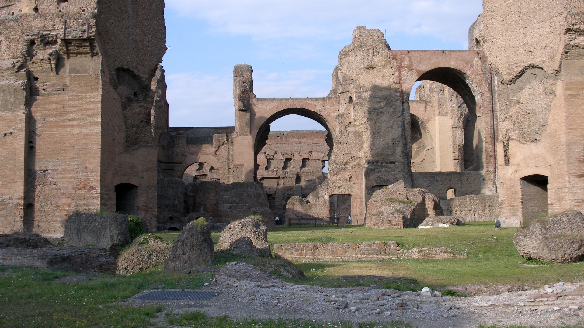 Massive ancient brick walls and vaulted ruins of the Baths of Caracalla in Rome.