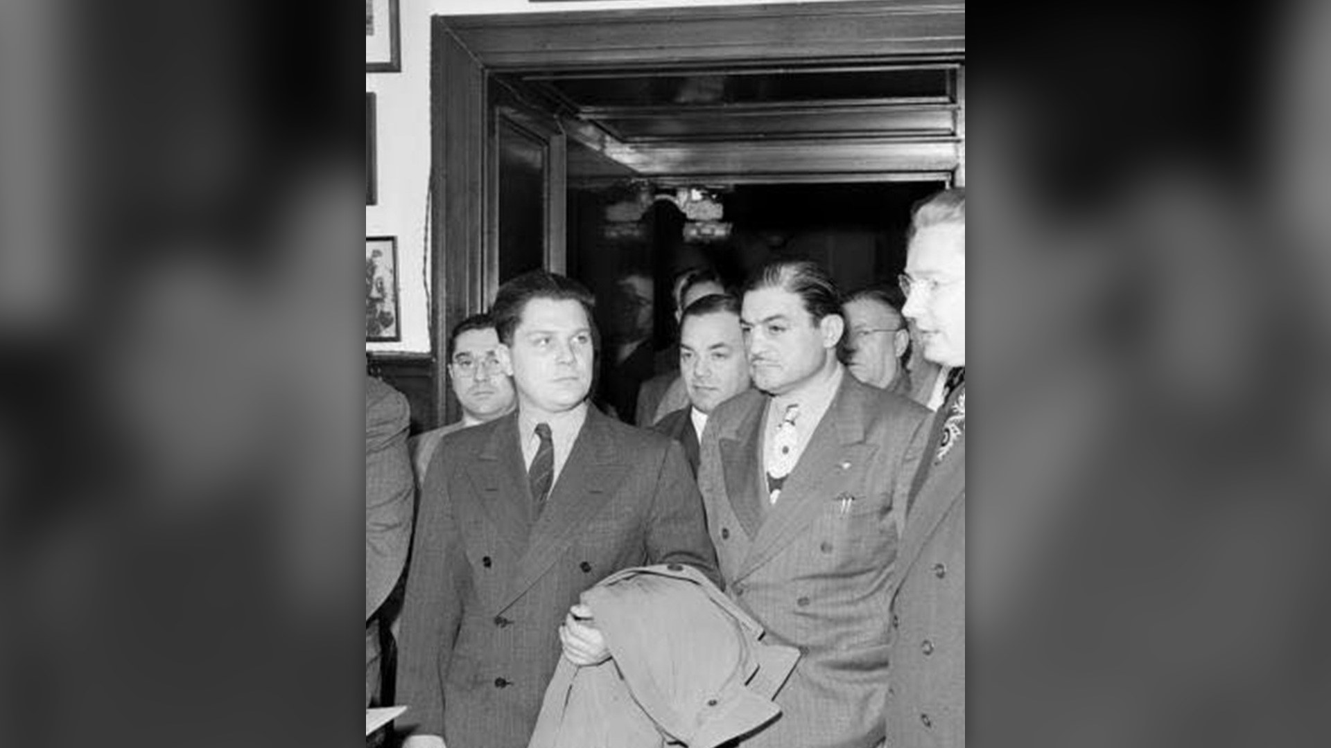 Jimmy Hoffa conversing with attorney John D. O'Connell in Detroit