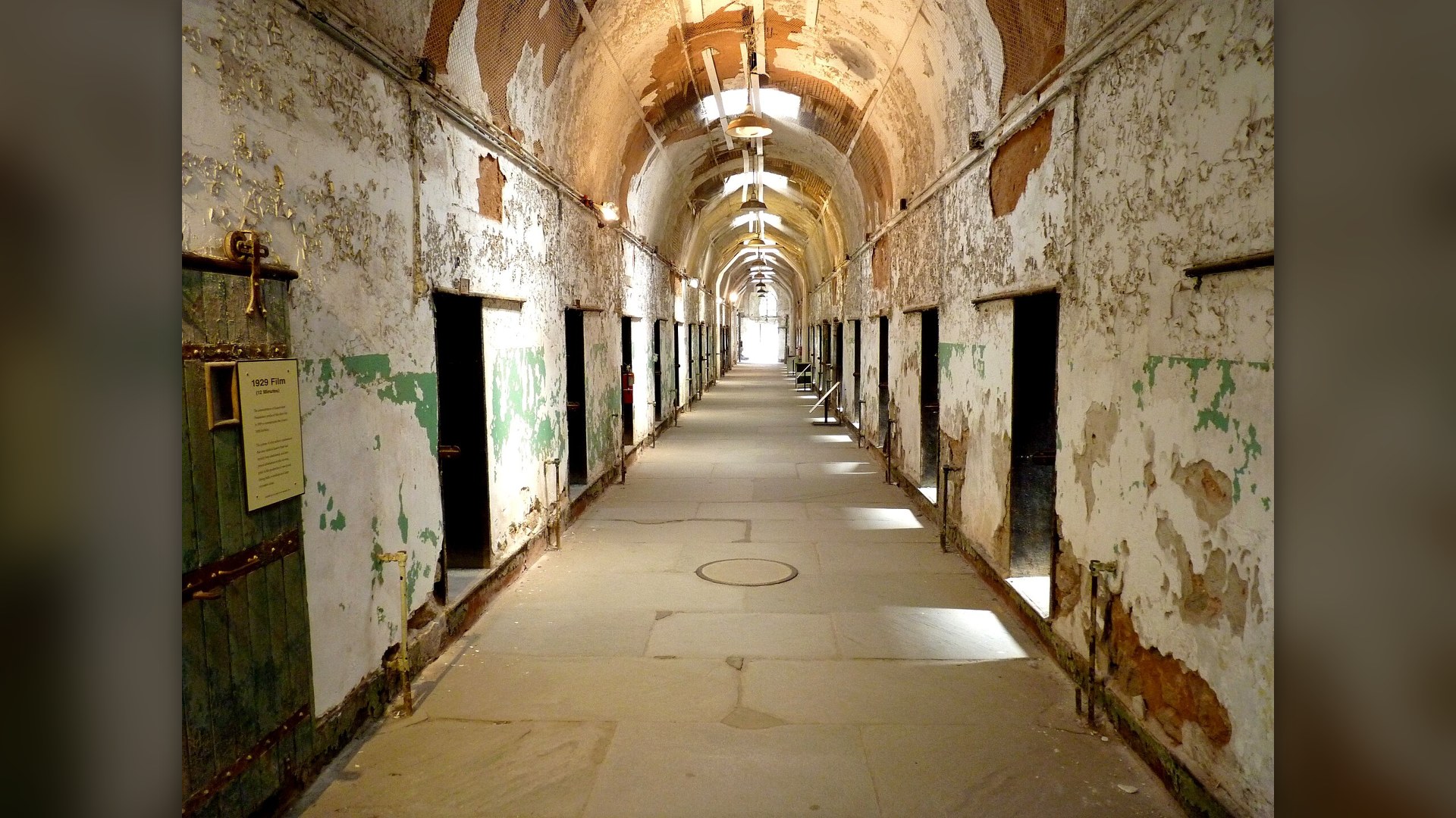 Long decaying vaulted hallway of Eastern State Penitentiary cell blocks