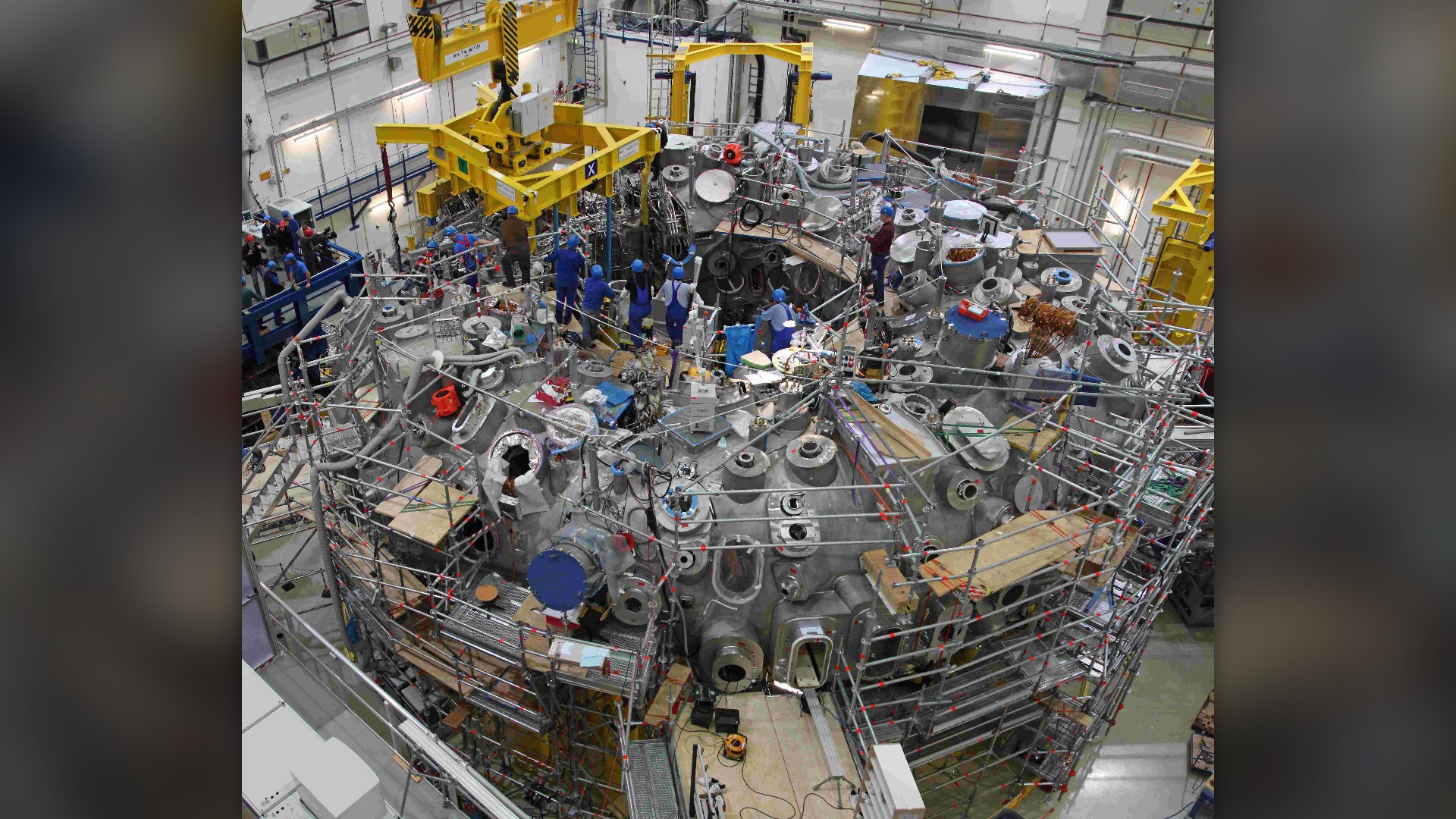 Complex twisted superconducting magnet coils of the Wendelstein 7-X stellarator in Greifswald.