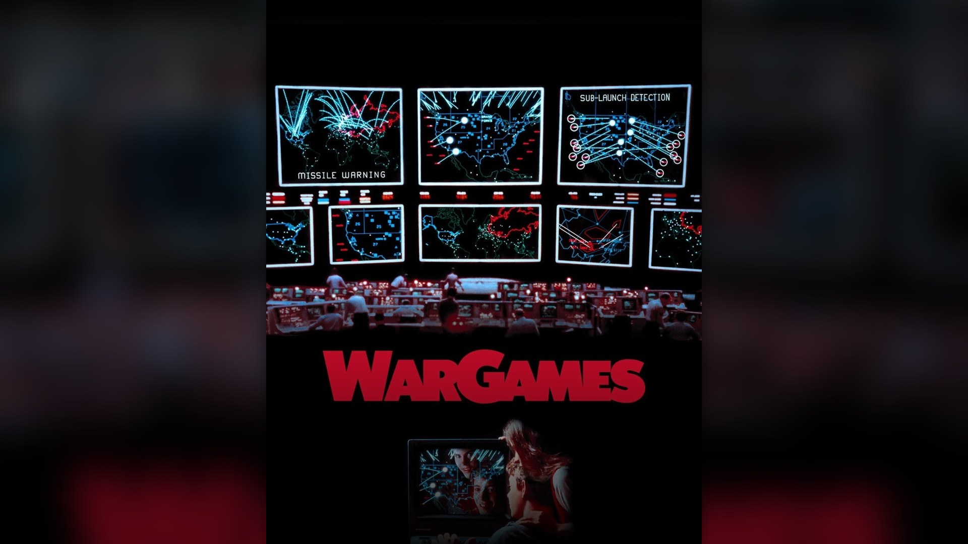 Matthew Broderick sitting in front of his 1980s computer terminal in WarGames.
