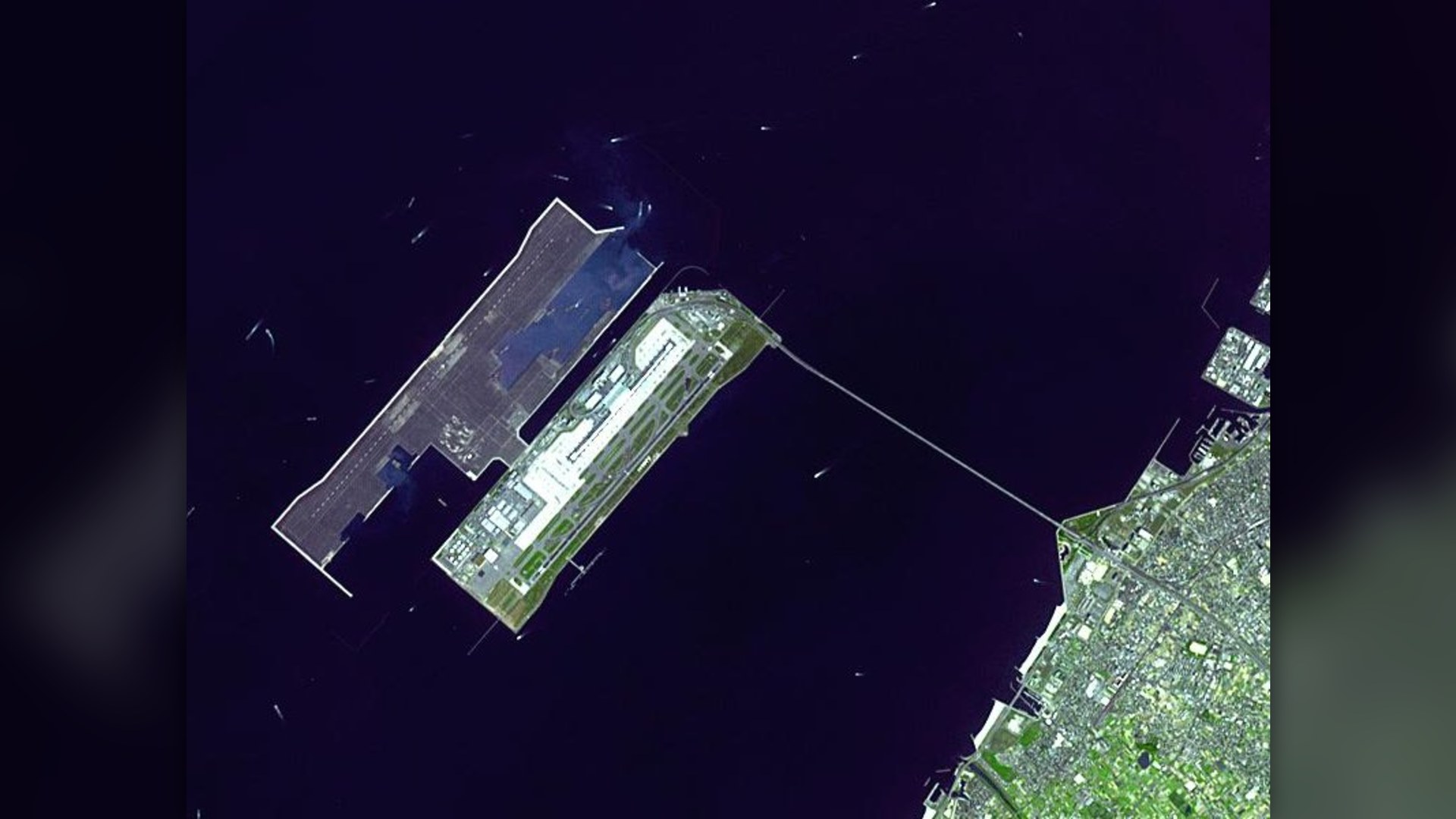 Aerial view of Kansai International Airport on its artificial island in Osaka Bay, Japan.