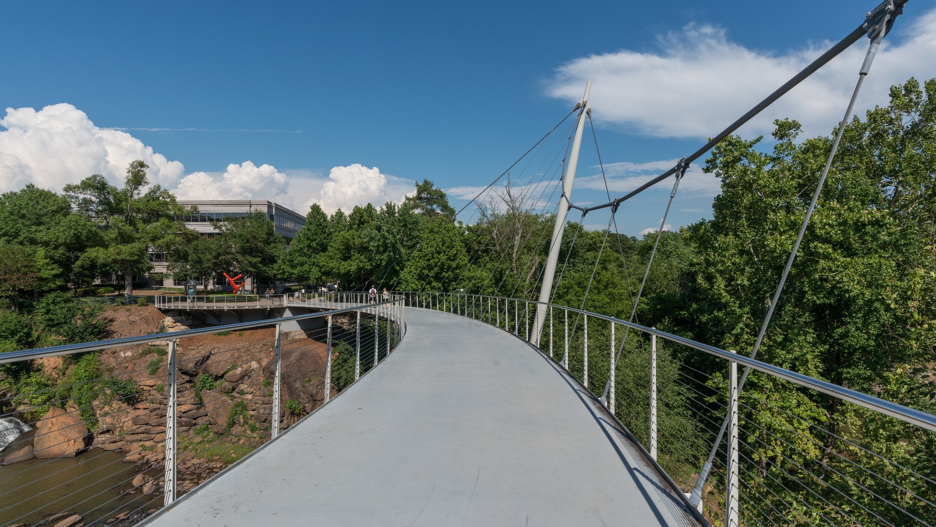 Liberty Bridge and lush foliage at Falls Park on the Reedy in Greenville, South Carolina.