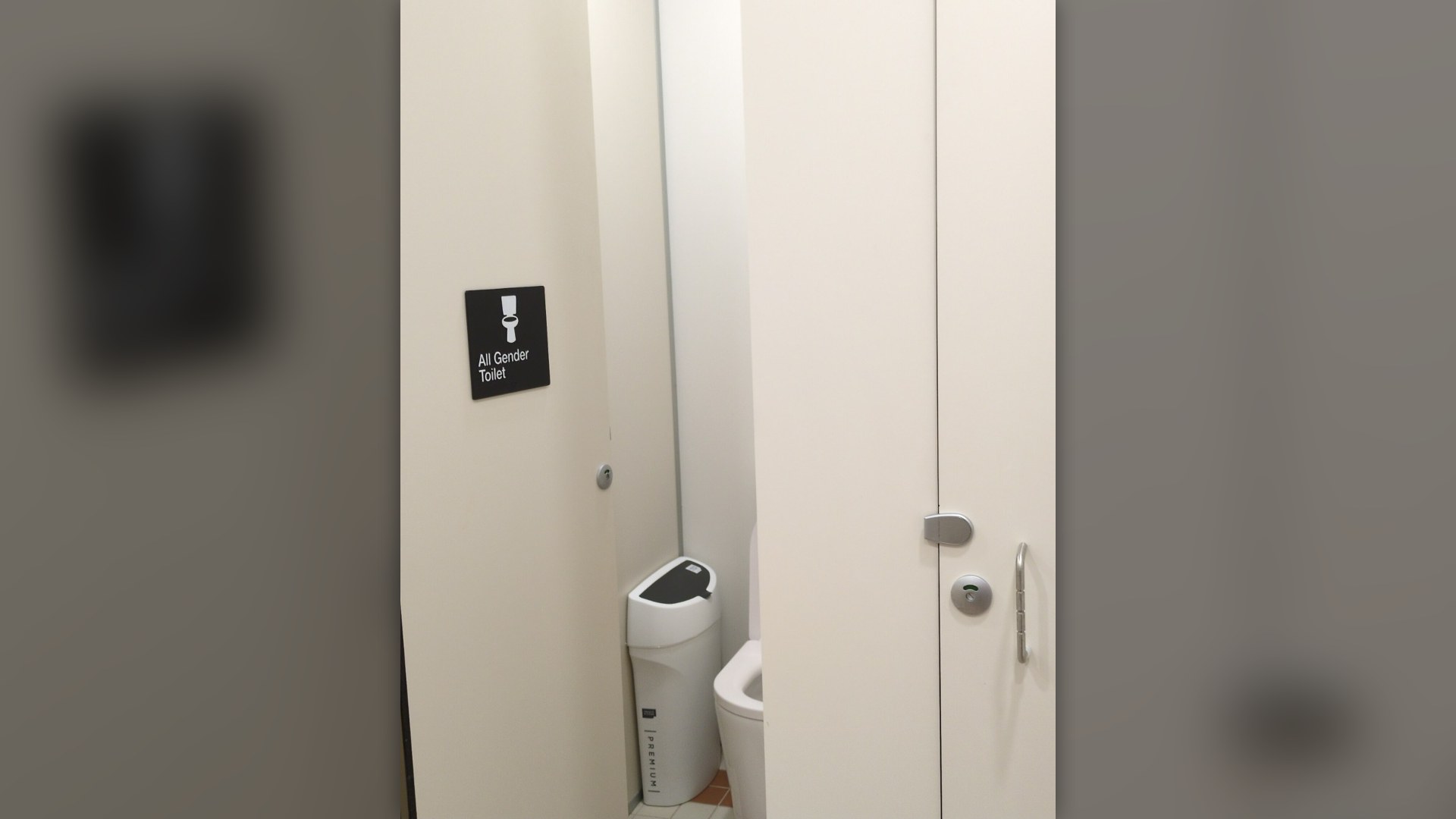 Public restroom stalls with gaps