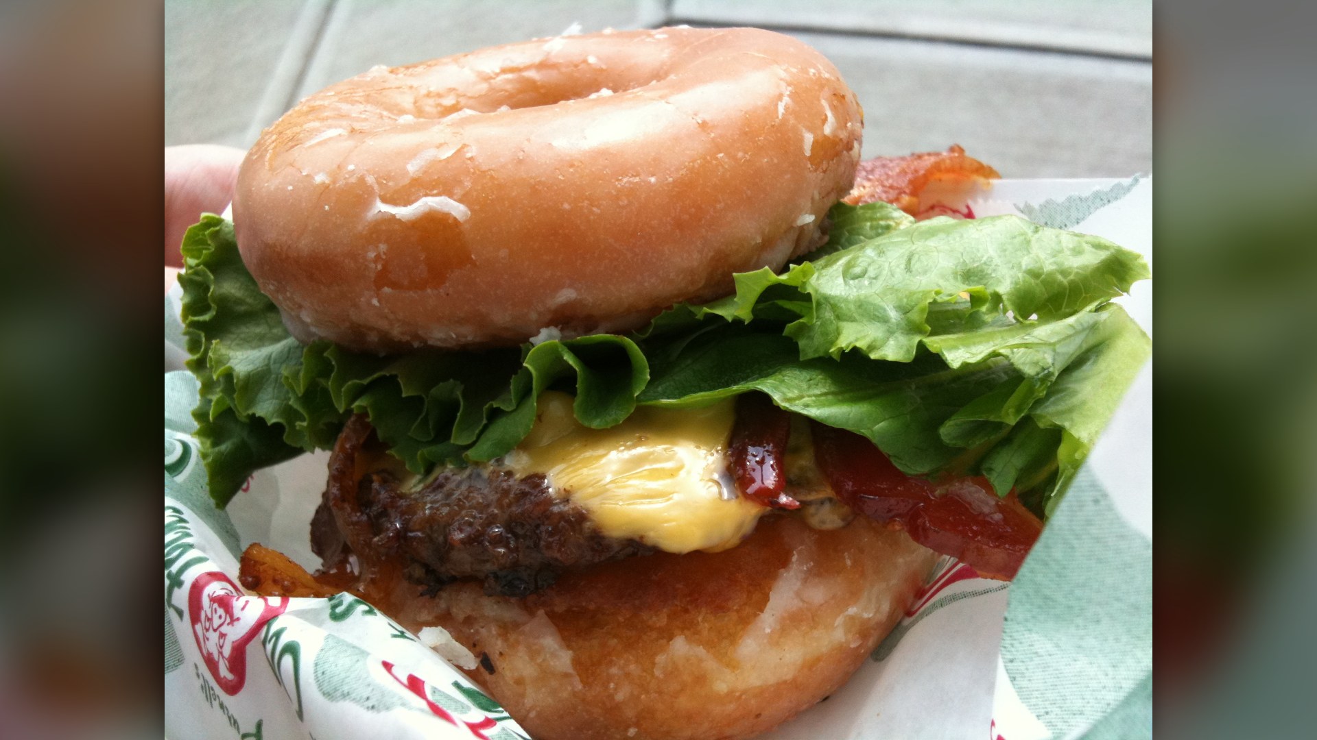 A bacon cheeseburger served between two sugar-glazed donuts.