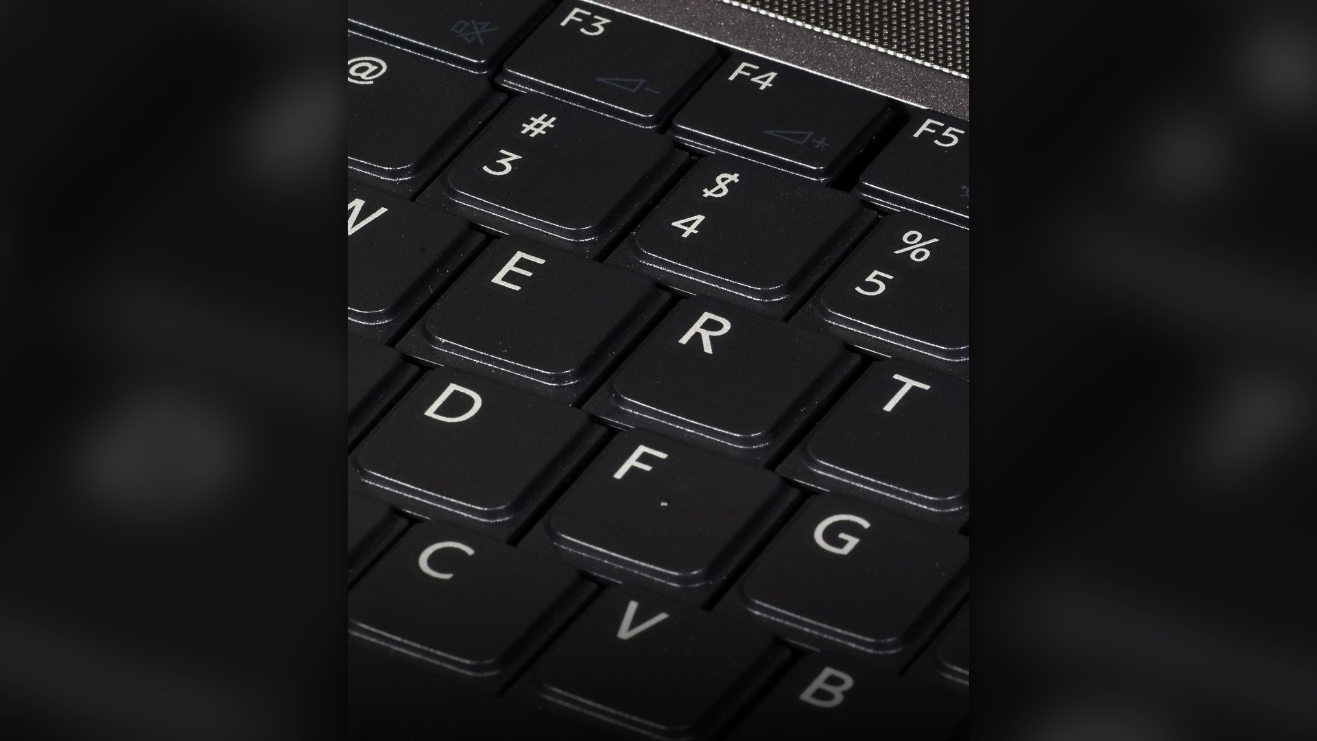 Close-up of a desktop QWERTY computer keyboard.