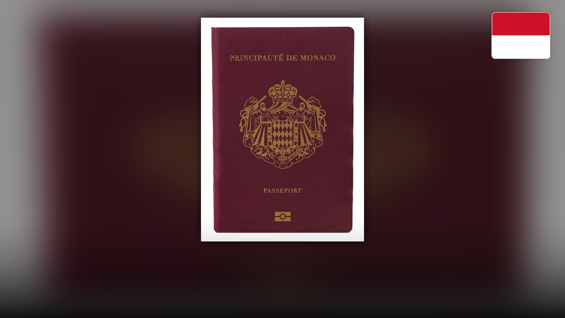 Burgundy passport cover of the Principality of Monaco with the Grimaldi coat of arms.