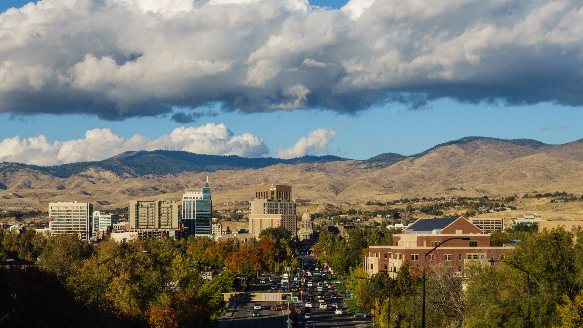 Downtown Boise, Idaho surrounded by golden October autumn foliage and foothills.