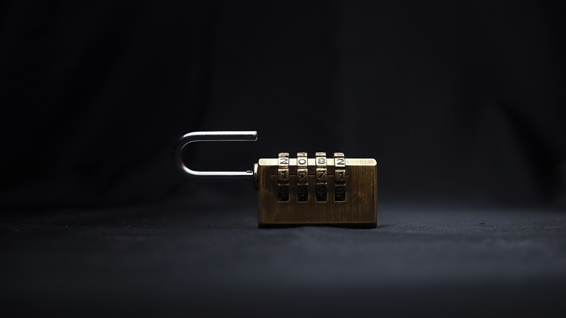 A 4-dial combination security padlock for luggage zips.