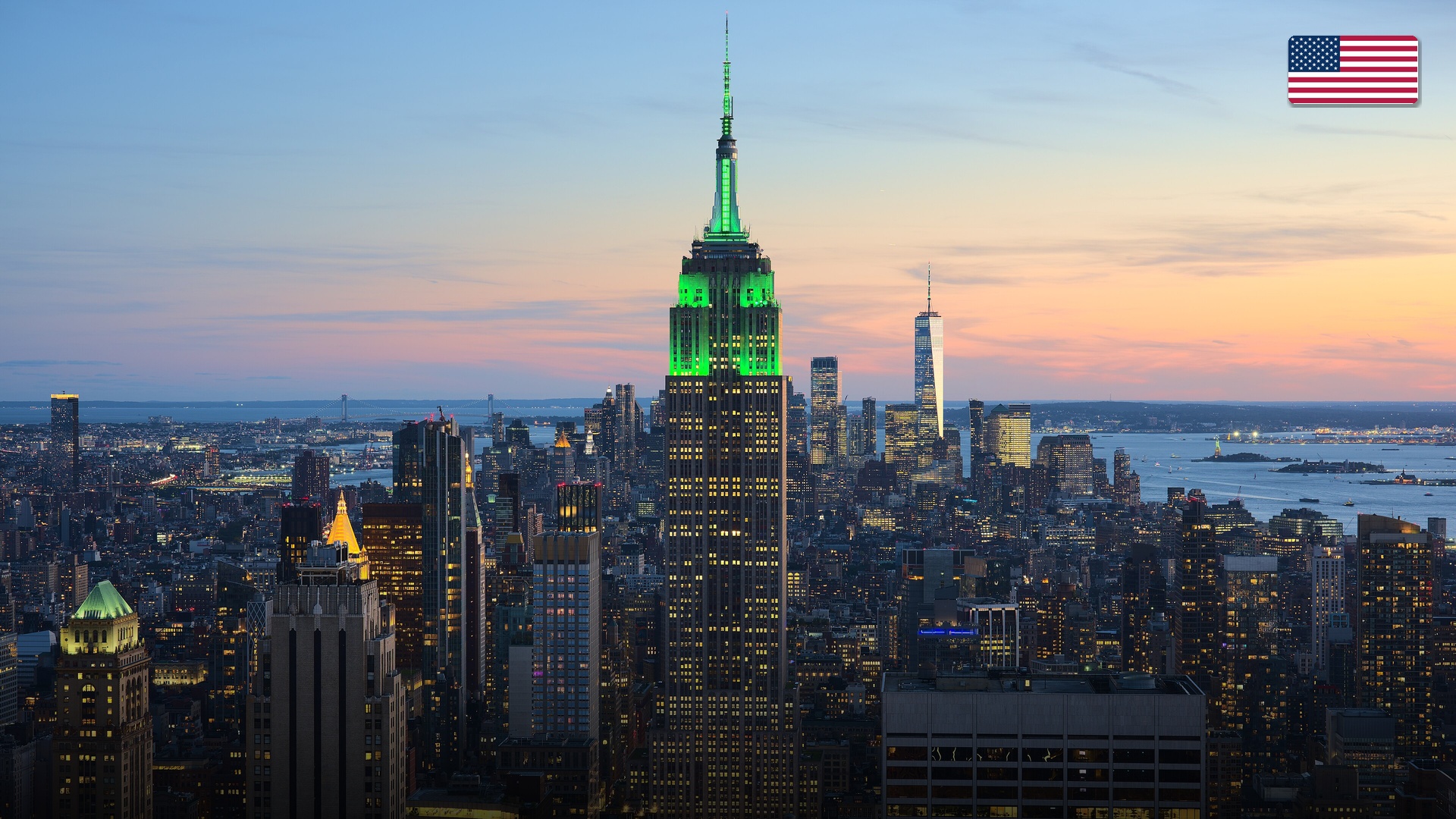 The iconic Manhattan skyline featuring the Empire State Building glowing at twilight.