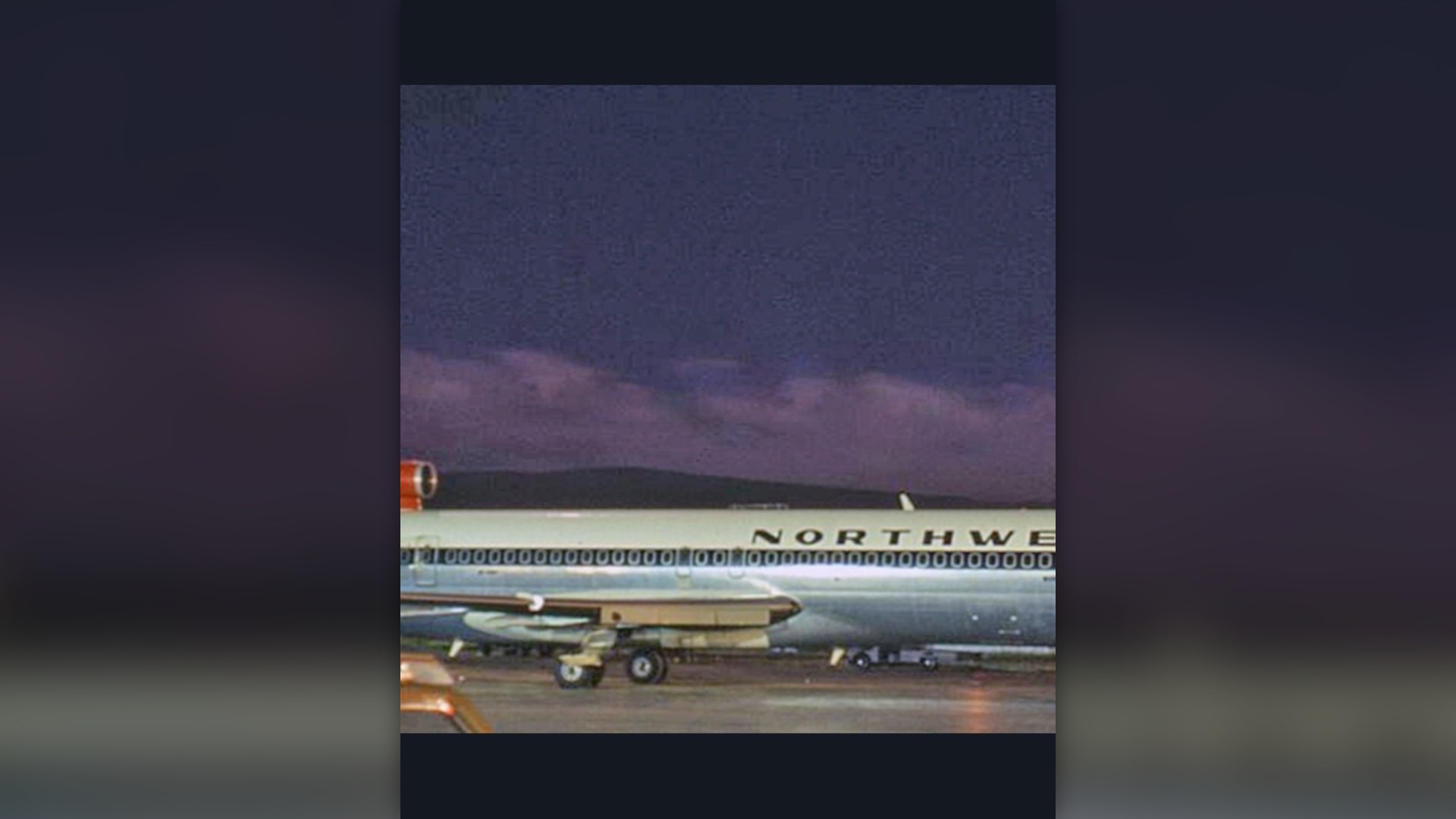 Northwest Orient Airlines Boeing 727 airliner shown on tarmac in historic livery