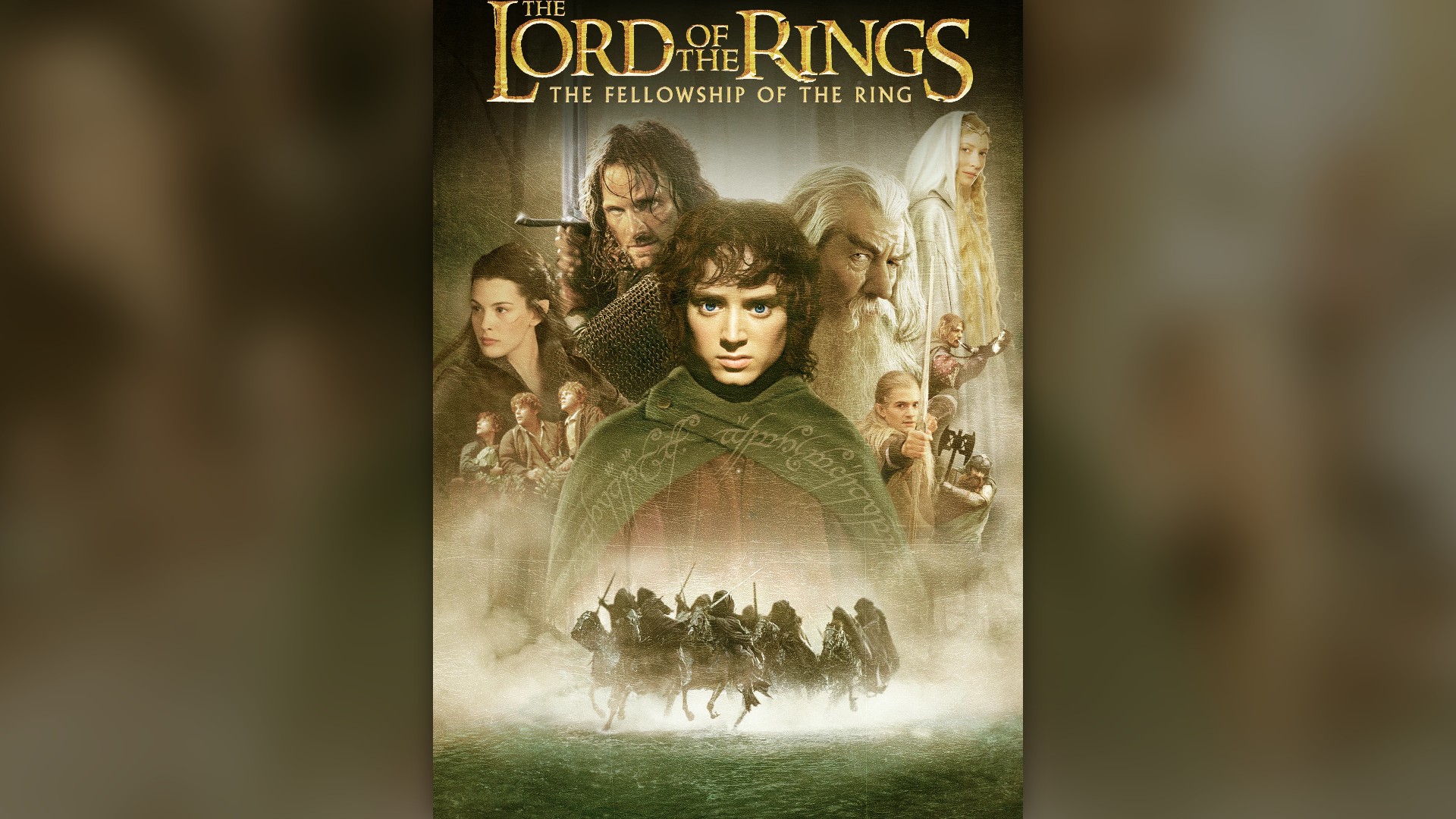 The Fellowship of nine companions treks across a rugged alpine mountain ridge against snowy peaks in The Lord of the Rings.