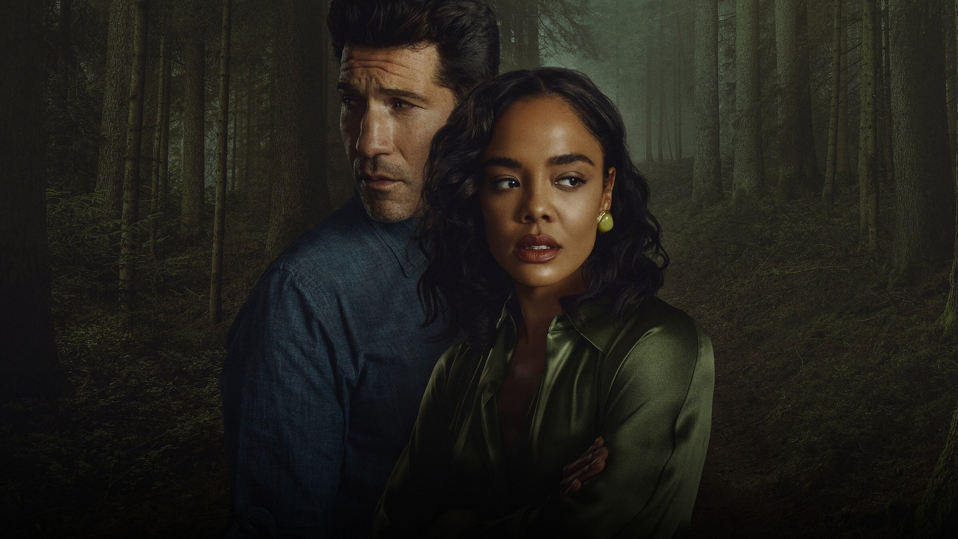Tessa Thompson and Jon Bernthal standing together in an atmospheric misty forest setting.