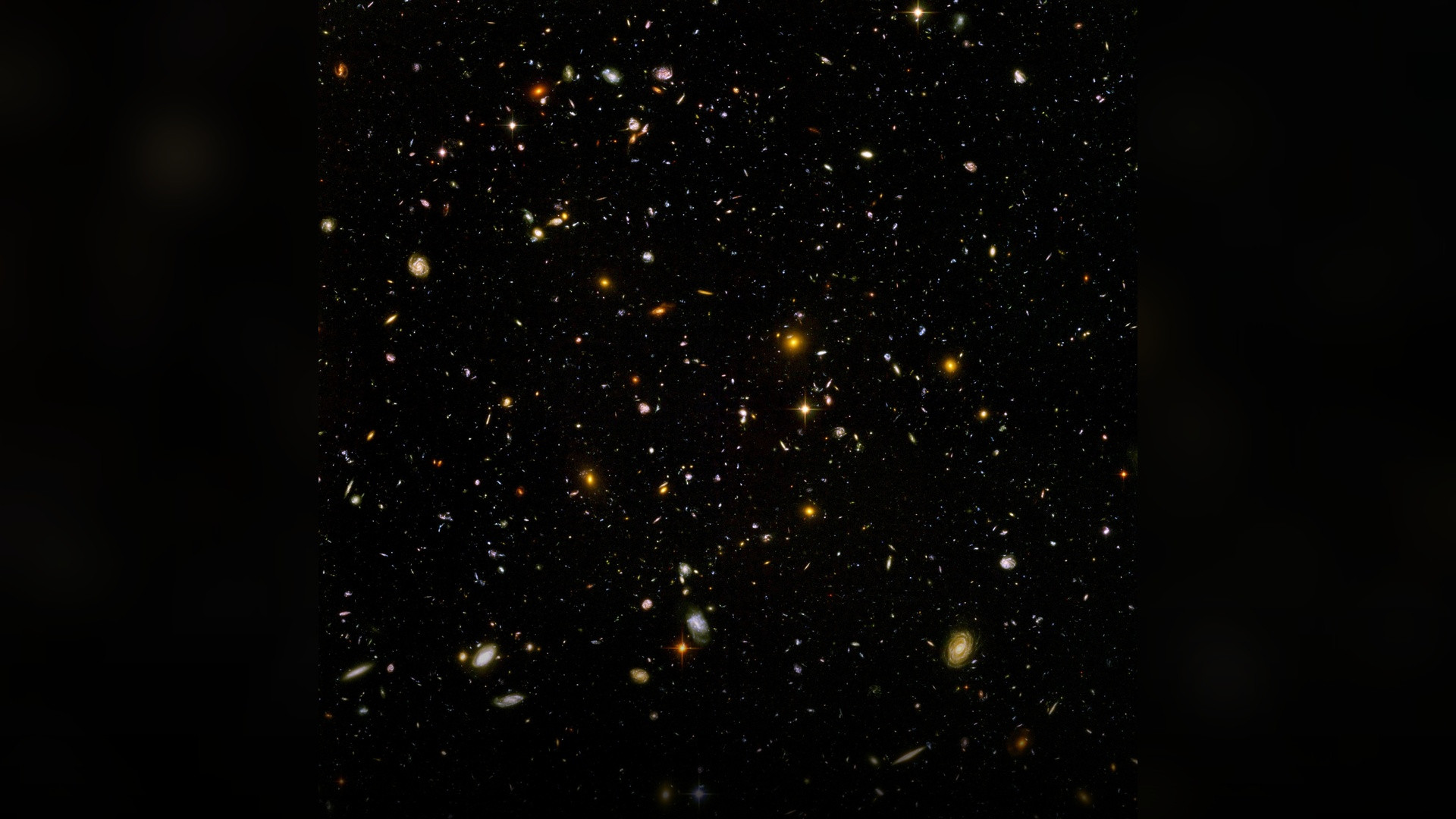 The Hubble Ultra Deep Field revealing thousands of distant galaxies against deep cosmic space.