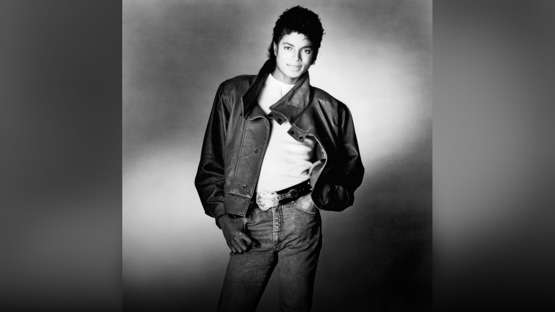 Michael Jackson smiling during a public tour appearance