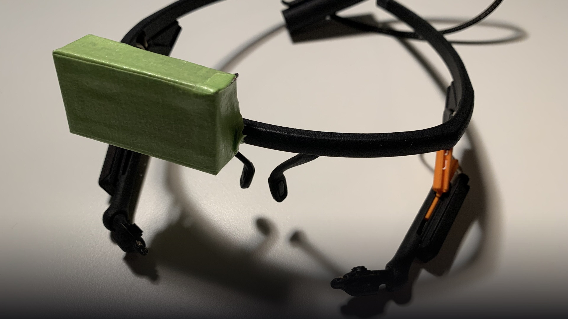Hardware pupil-tracking optical rig showing infrared illuminators and gaze-direction cameras.