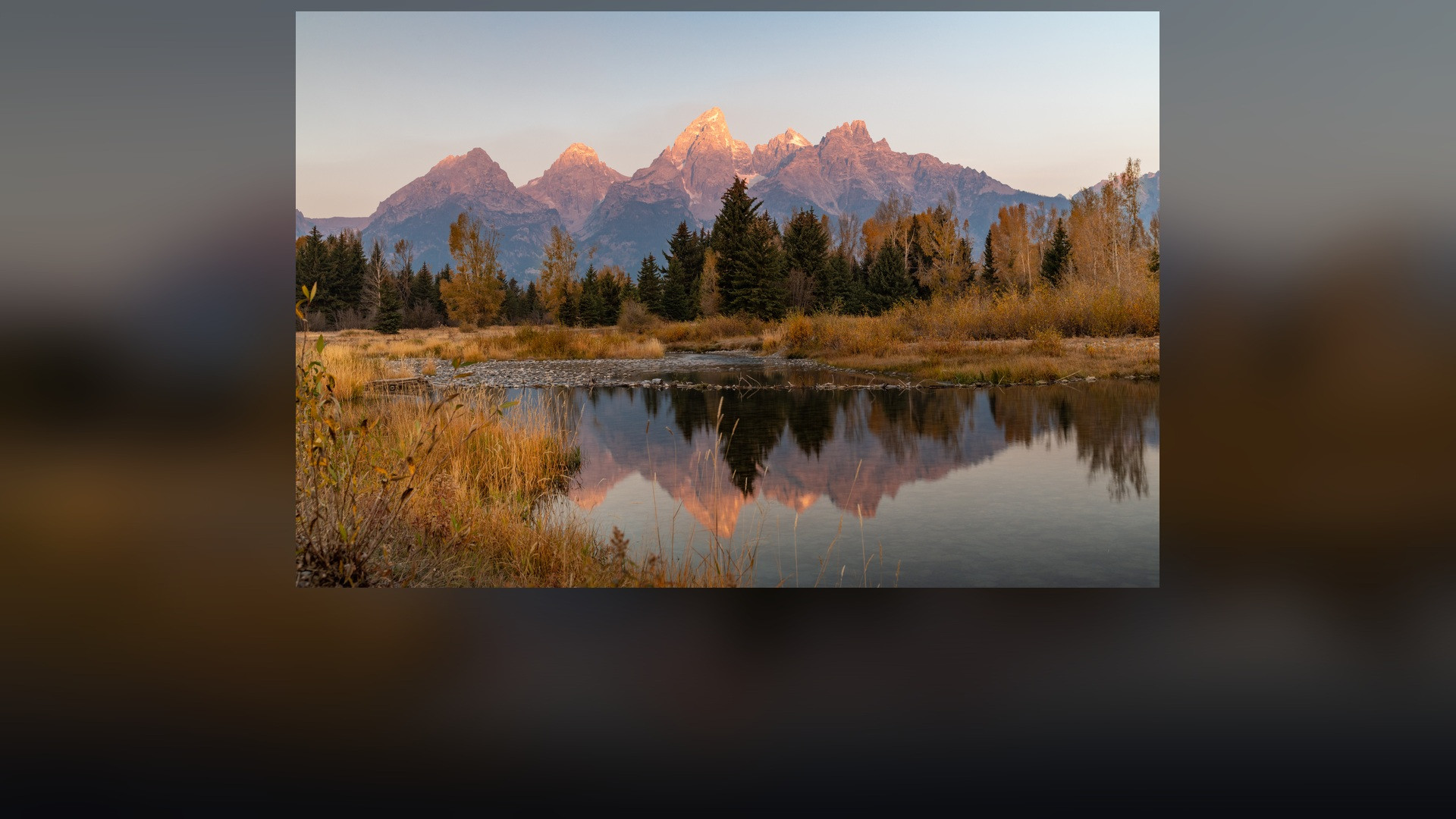 Panoramic landscape vista of Grand Teton National Park showing natural geological formations, terrain, and wilderness.