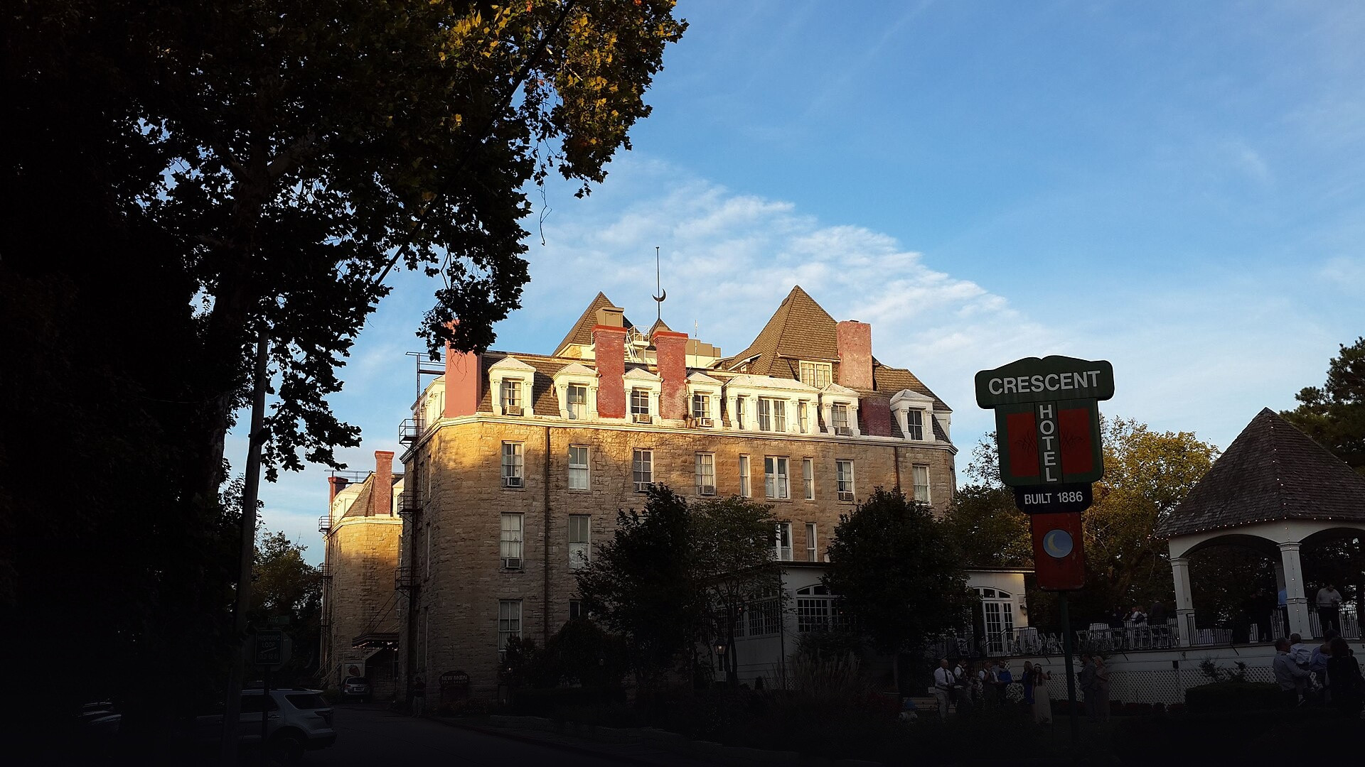 Stately Victorian limestone facade and verandas of the 1886 Crescent Hotel perched on West Mountain in Eureka Springs, Arkansas.