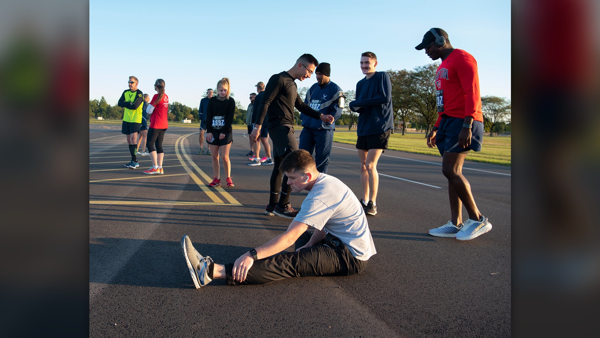 Marathon runners pushing through lower-leg muscle fatigue on a road course