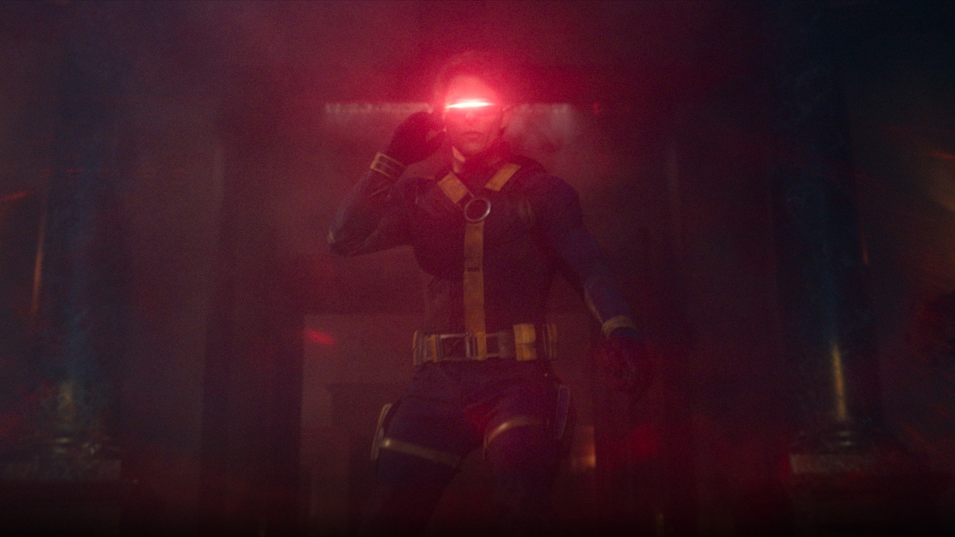 James Marsden as Cyclops in leather X-Men uniform unleashing optic blasts through his ruby visor.