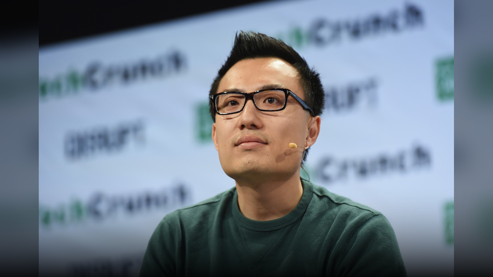 Tony Xu speaking on stage at TechCrunch Disrupt.