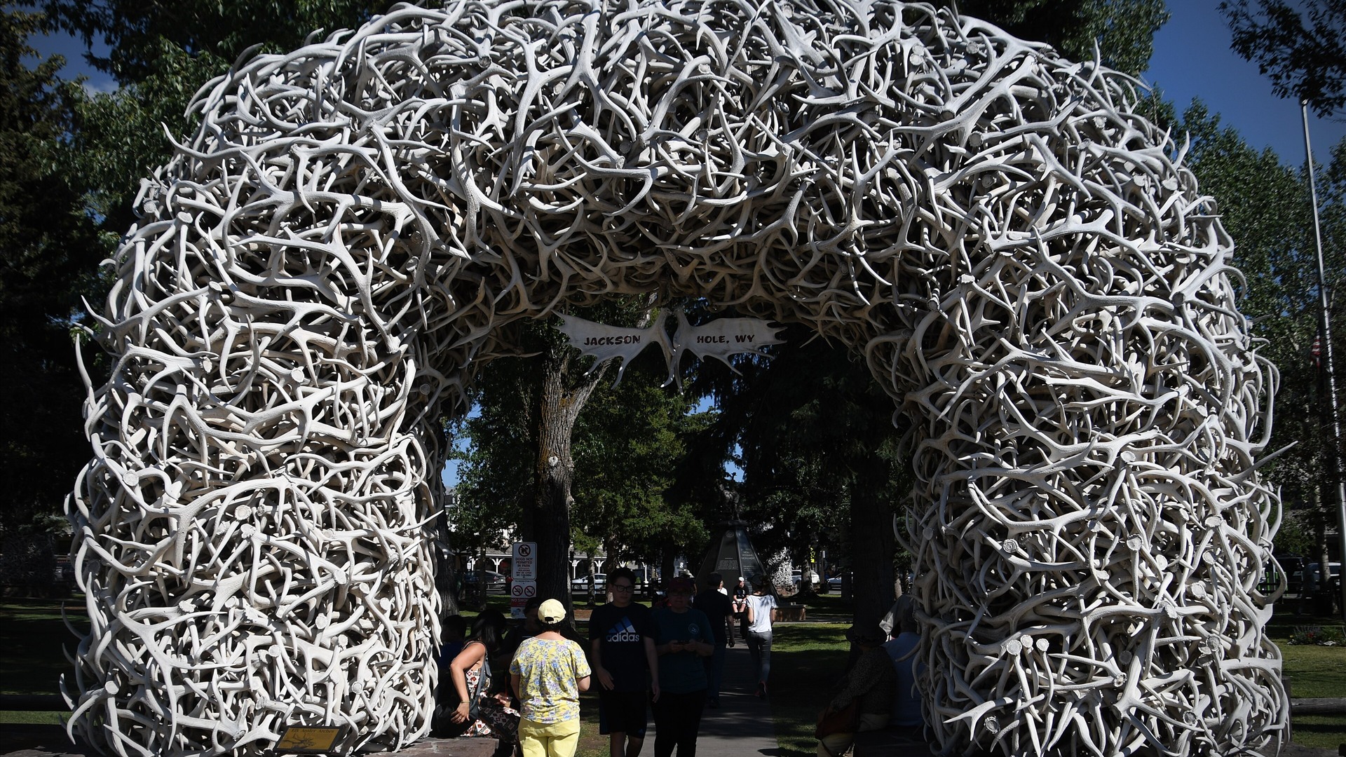 Iconic elk antler arch at Town Square in Jackson, Wyoming with mountain backdrop