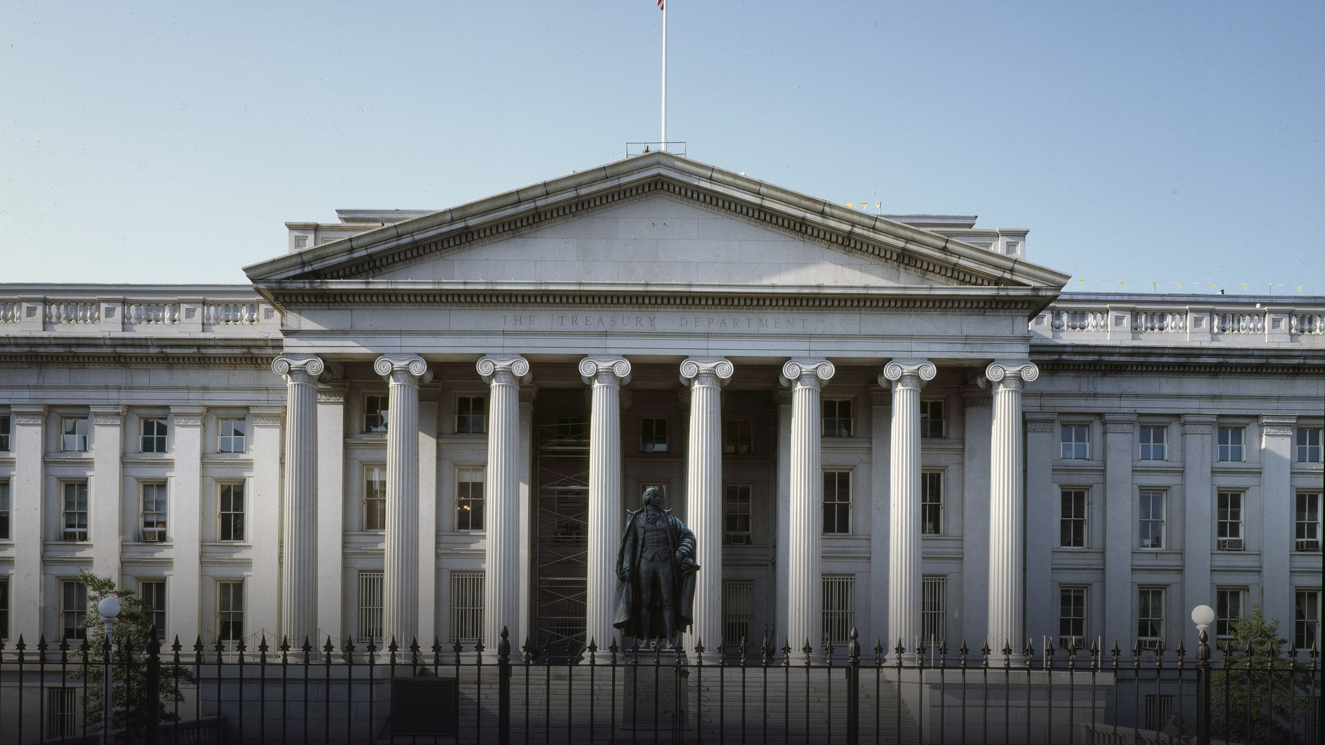 Grand neoclassical facade and ionic colonnade of the Department of the Treasury building in Washington, D.C.