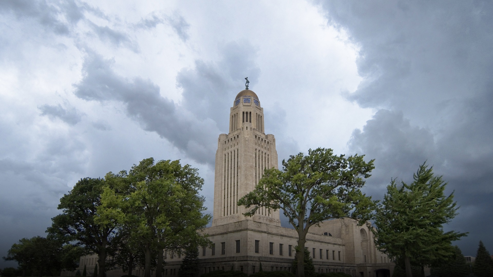 The towering domed Nebraska State Capitol building rising against the sky in Lincoln Nebraska.